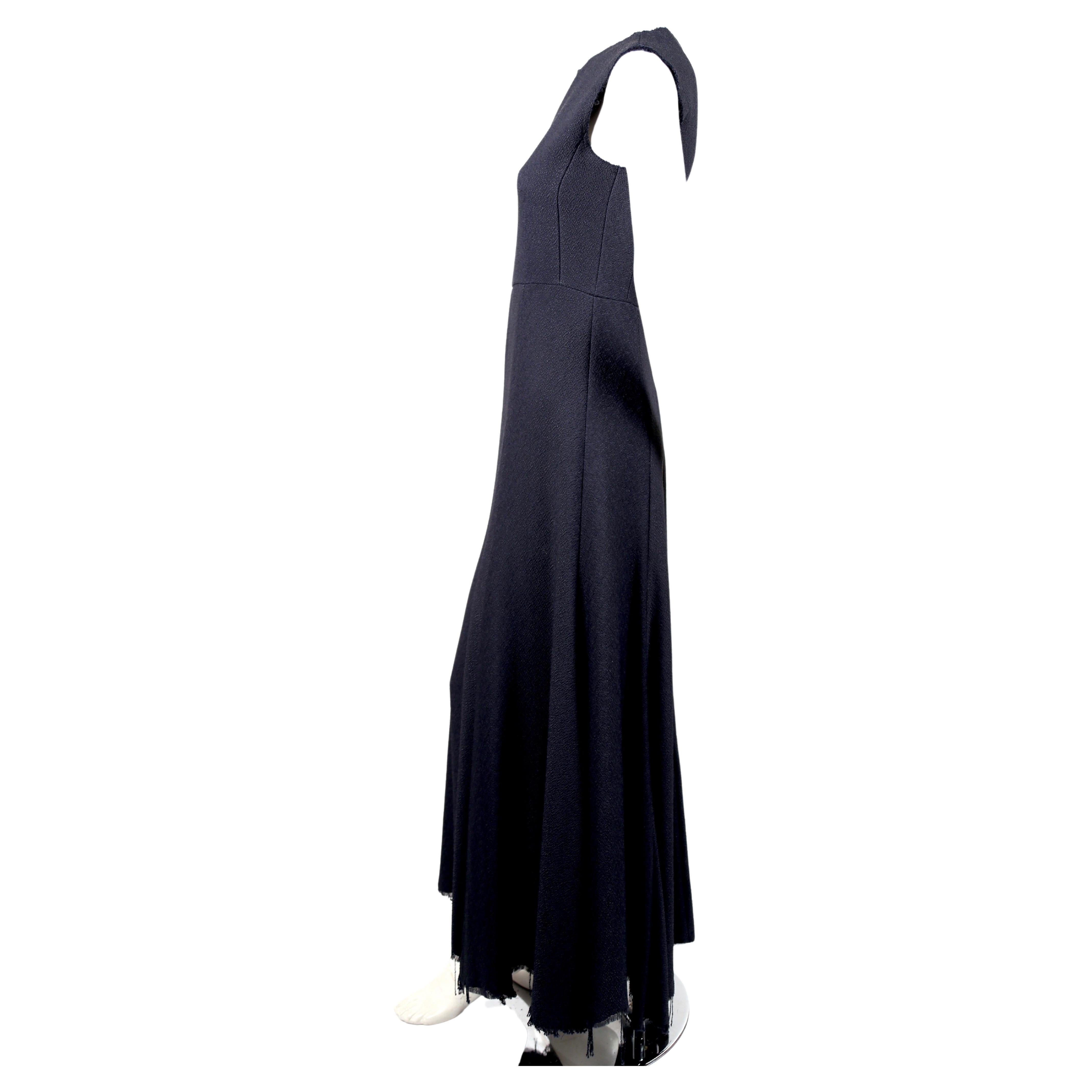 Very rare, deepest navy blue seamed maxi dress with raw edges and fringed hemline designed by Phoebe Philo for Celine exactly as seen on the 2013 spring runway and featured in the spring 2013 Celine ad campaign. Color is deep navy blue, almost