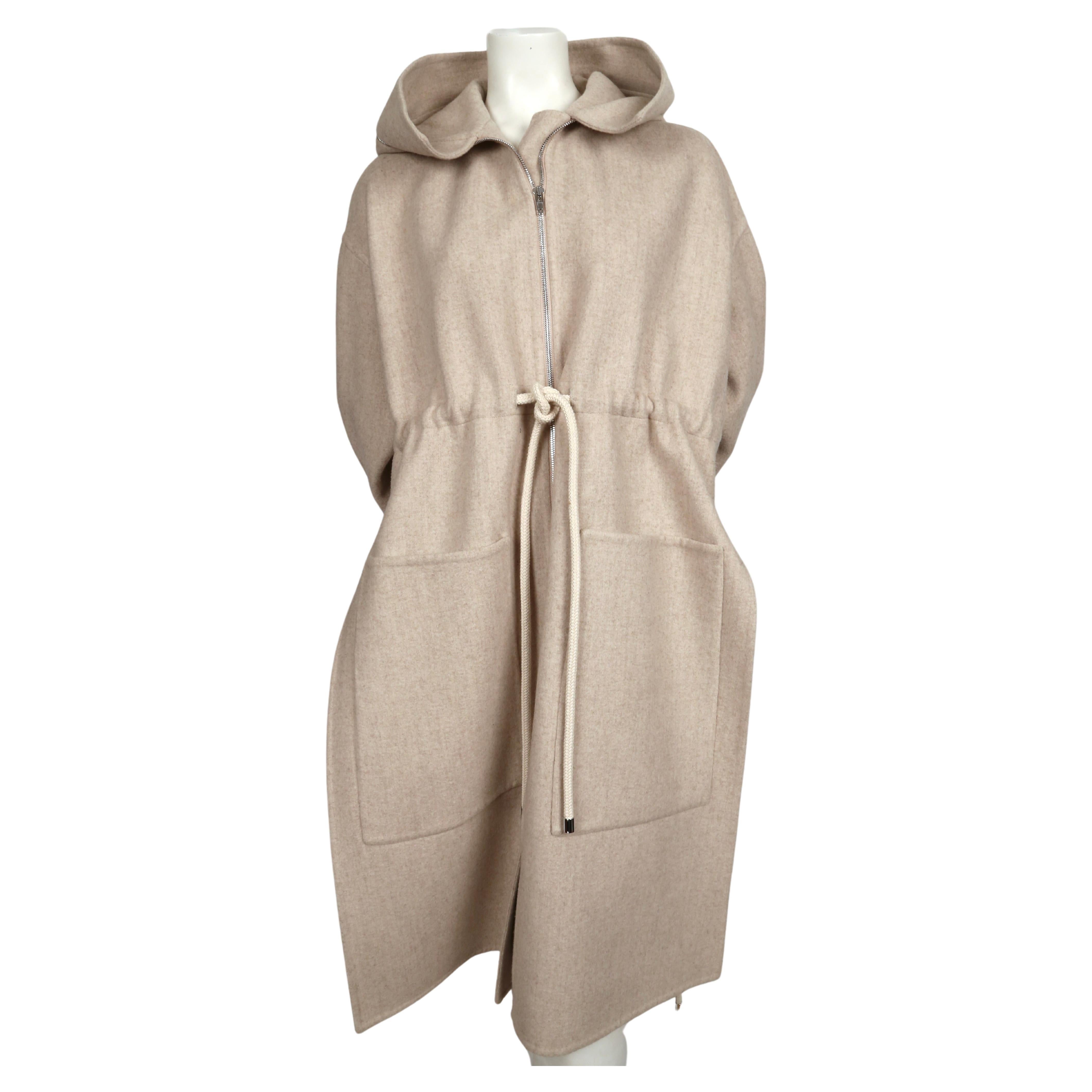 Oversized oatmeal wool coat with hood designed by Phoebe Philo for Celine dating to resort of 2016. French size 36 however this coat has a very oversized fit. Approximate measurements: drop shoulder 23