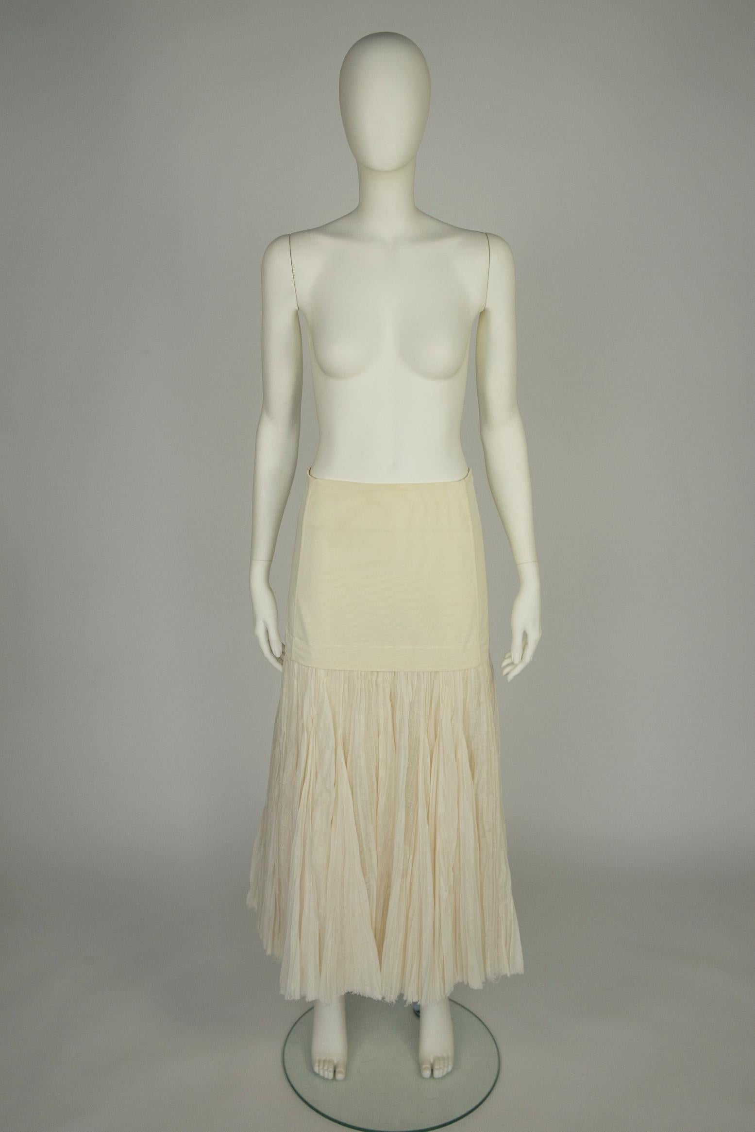 As seen on the Spring 2014 runway show (looks 38 & 40), this Céline by Phoebe Philo has a slight flare silhouette. Designed with a fitted band at the waist, this pleated maxi skirt is cut from lightweight off-white linen that cascades to a flouncy
