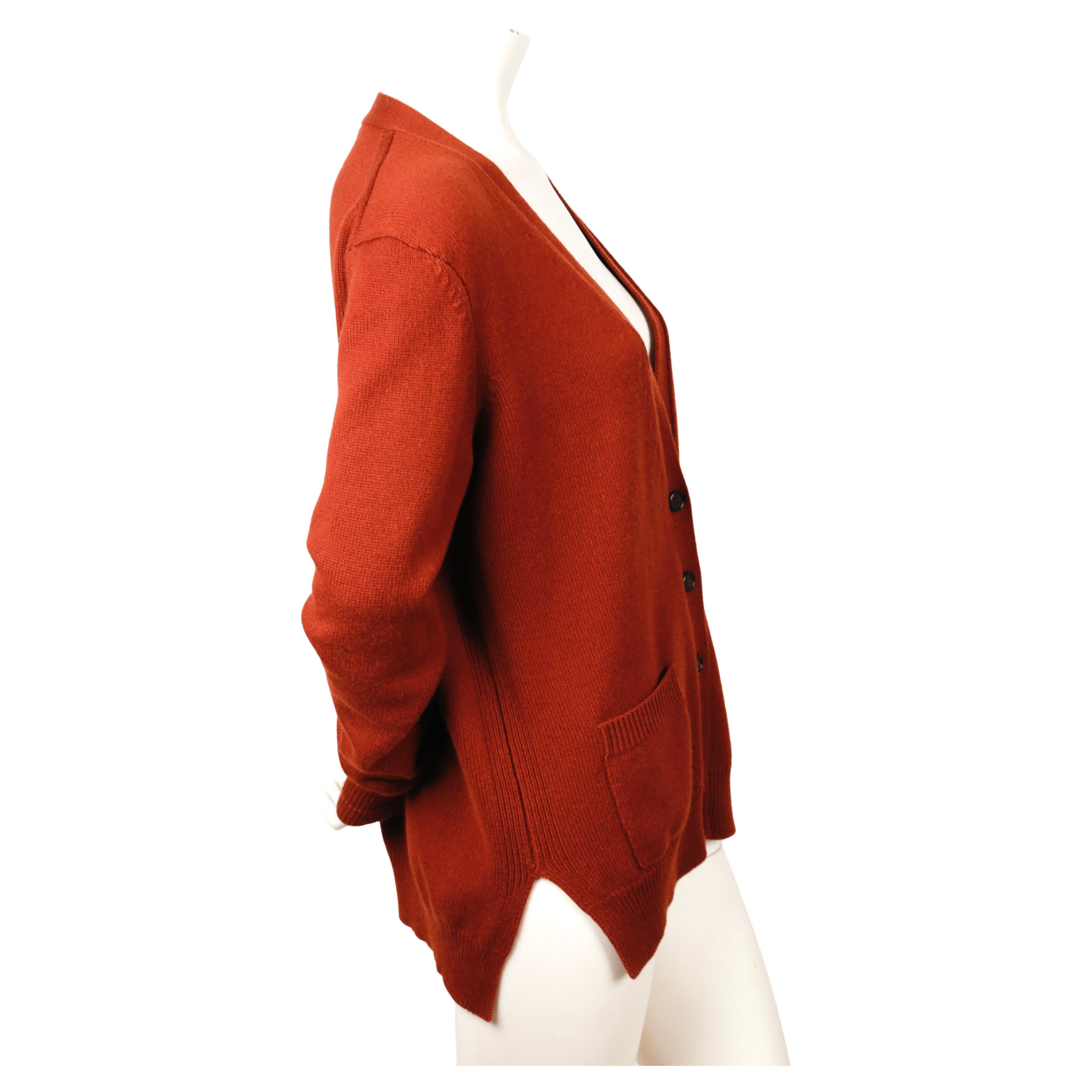 Dark rust cashmere cardigan designed by Phoebe Philo for Celine. Size 'M'.  Approximate measurements: (unstretched): shoulders 18