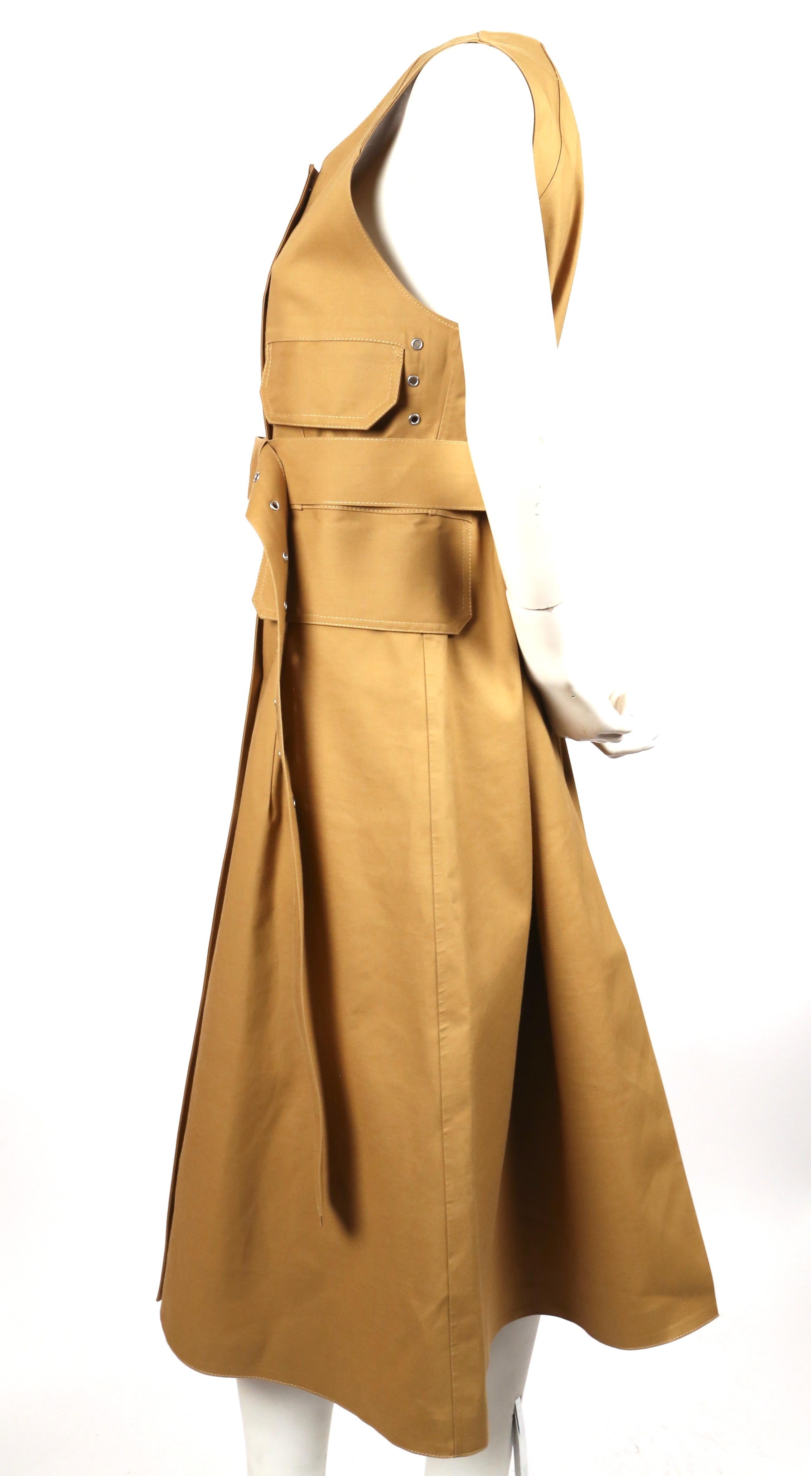Sleeveless, tan, cotton mackintosh with matching belt designed by Phoebe Philo for Celine exactly as seen on the fall 2016 runway. Very rare piece. Labeled a French size 38. Approximate measurements: shoulders 14