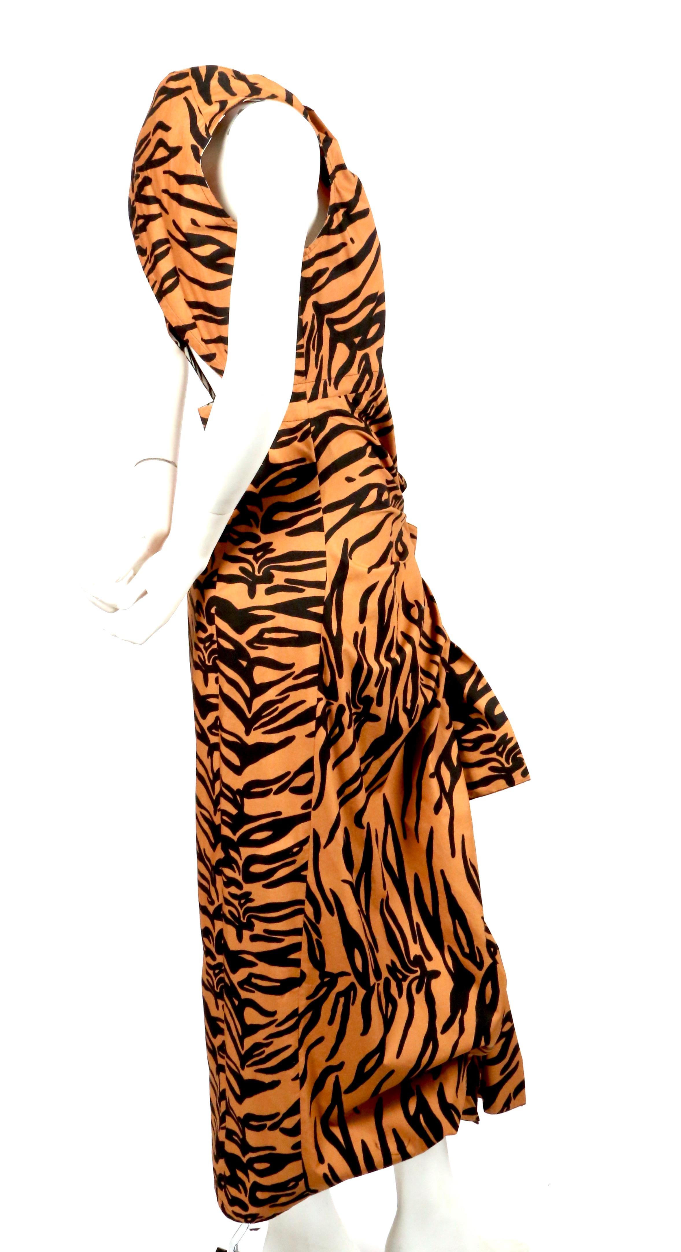 Tiger printed, cotton dress with draped ties and open back designed by Phoebe Philo for Celine. Dress is labeled a French size 38. Measurements are very difficult to take for this piece however it was not clipped on the size 2 mannequin. Approximate