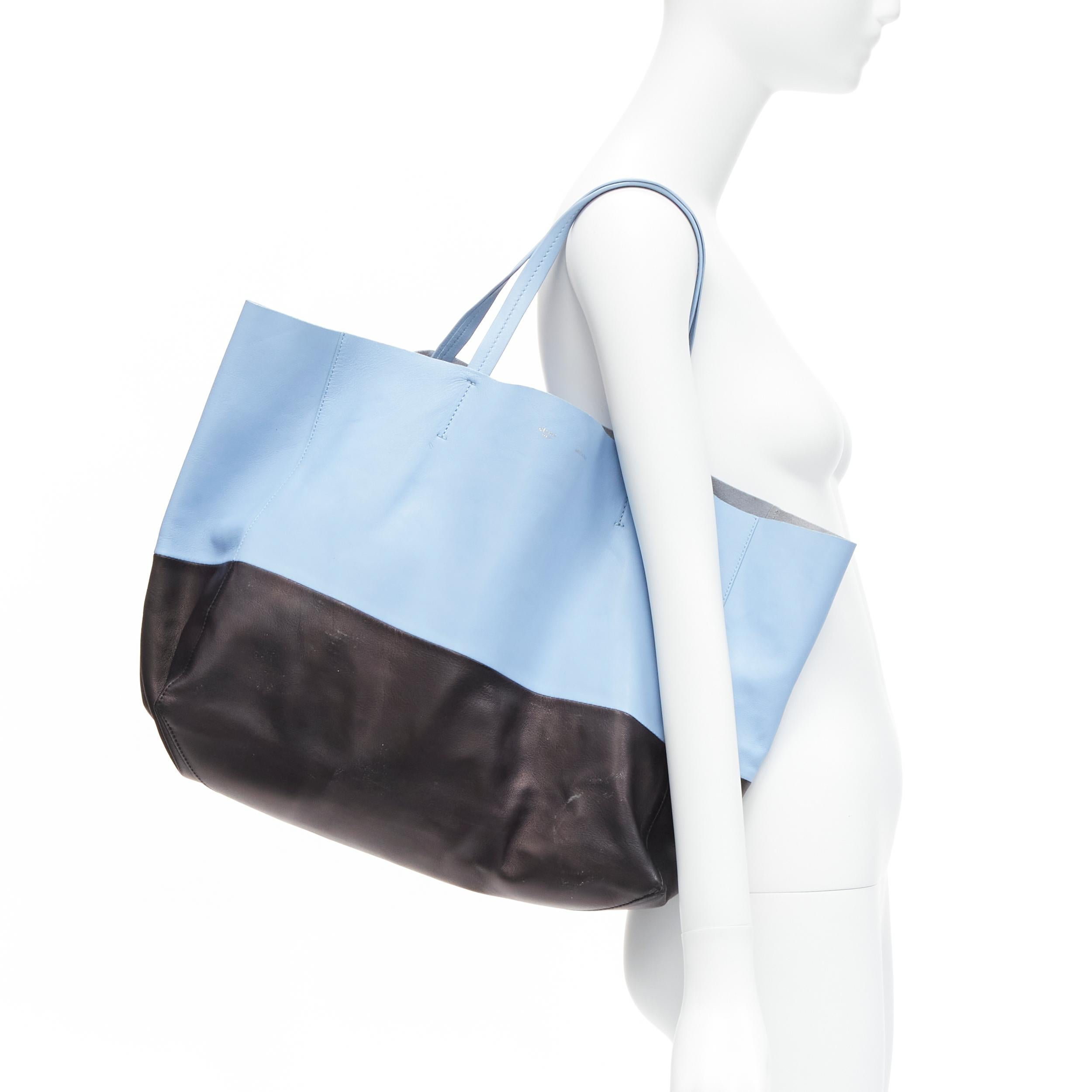 CELINE Cabat baby blue black colorblock panels gold logo tote bag
Reference: LNKO/A02135
Brand: Celine
Designer: Phoebe Philo
Model: Cabat
Material: Leather
Color: Blue, Black
Pattern: Solid
Lining: Blue Leather
Made in: Italy

CONDITION:
Condition: