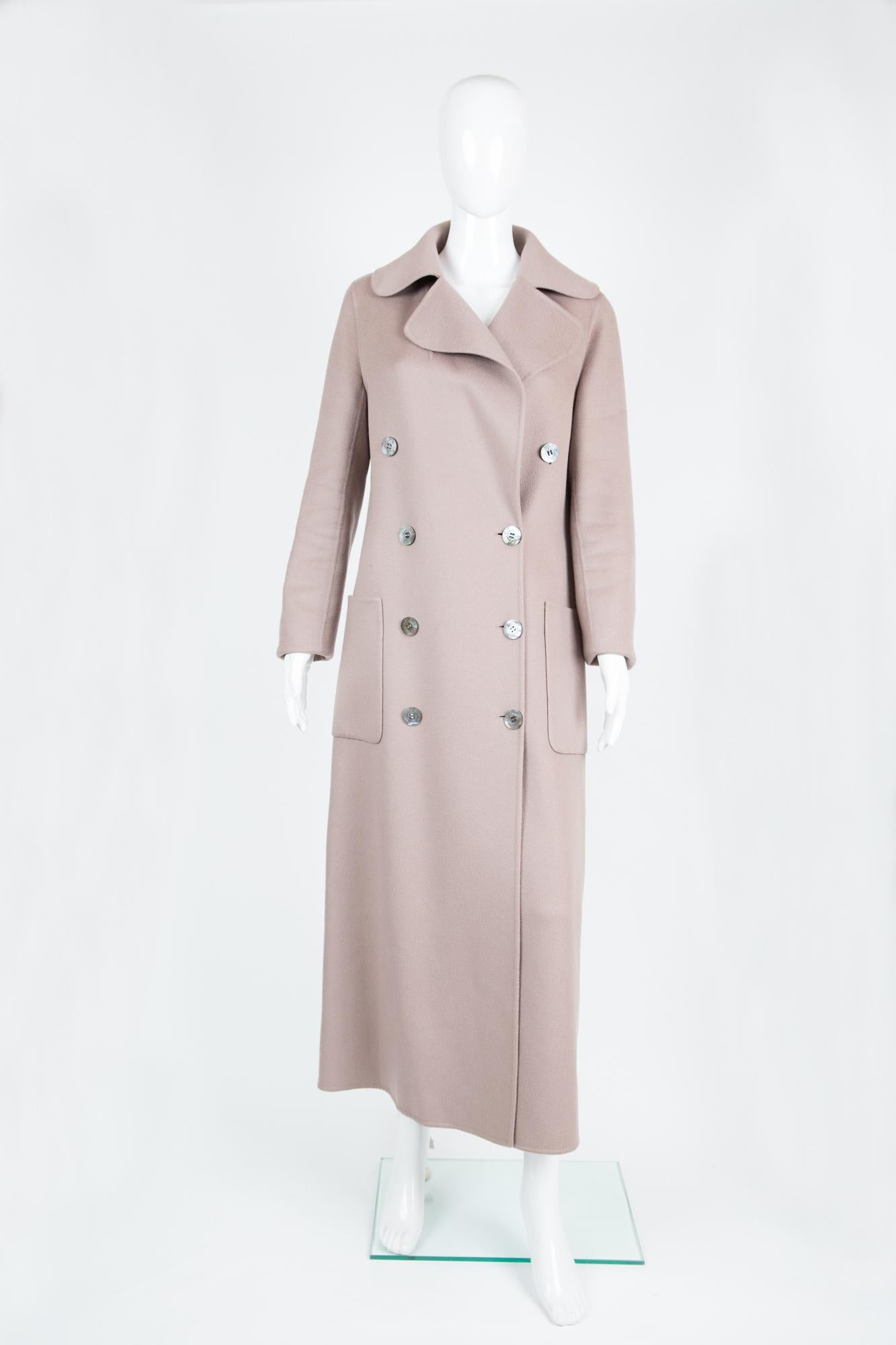 Blush color Celine 100% cashmere long coat featuring a double breasted opening, large pockets, front logo button fastening, a separated belt, very light as it is an unlined coat. 
Estimated size 40fr/US8/UK12
Composition: 100% cashmere, 
In