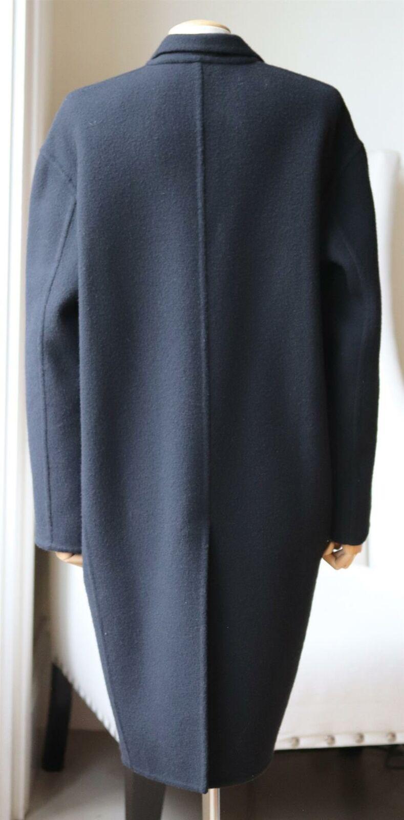 This Céline by Phoebe Philo coat has been made from sumptuously soft cashmere, the oversized silhouette has slim lapels. 
Black cashmere.
Slips on.
100% cashmere; lining: 100% silk.
Size: FR 40 (UK 12, US 8, IT 44).
Shoulder to shoulder measures