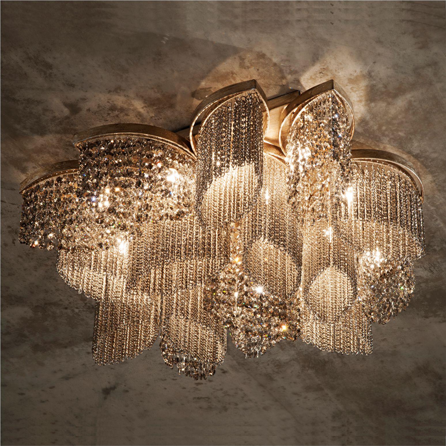 Crystal chandelier lamp by Aver
Dimensions: D 70 x W 70 x H 25 cm 
Materials: Nickel, Gold, Aged Gold. Clear, Satin, Golden. Crystal Rocks. 
Lighting: 16 x G9
Available in finishes: Silver Plated, Aged Silver Plated, Gold Plated, Aged Gold Plated.