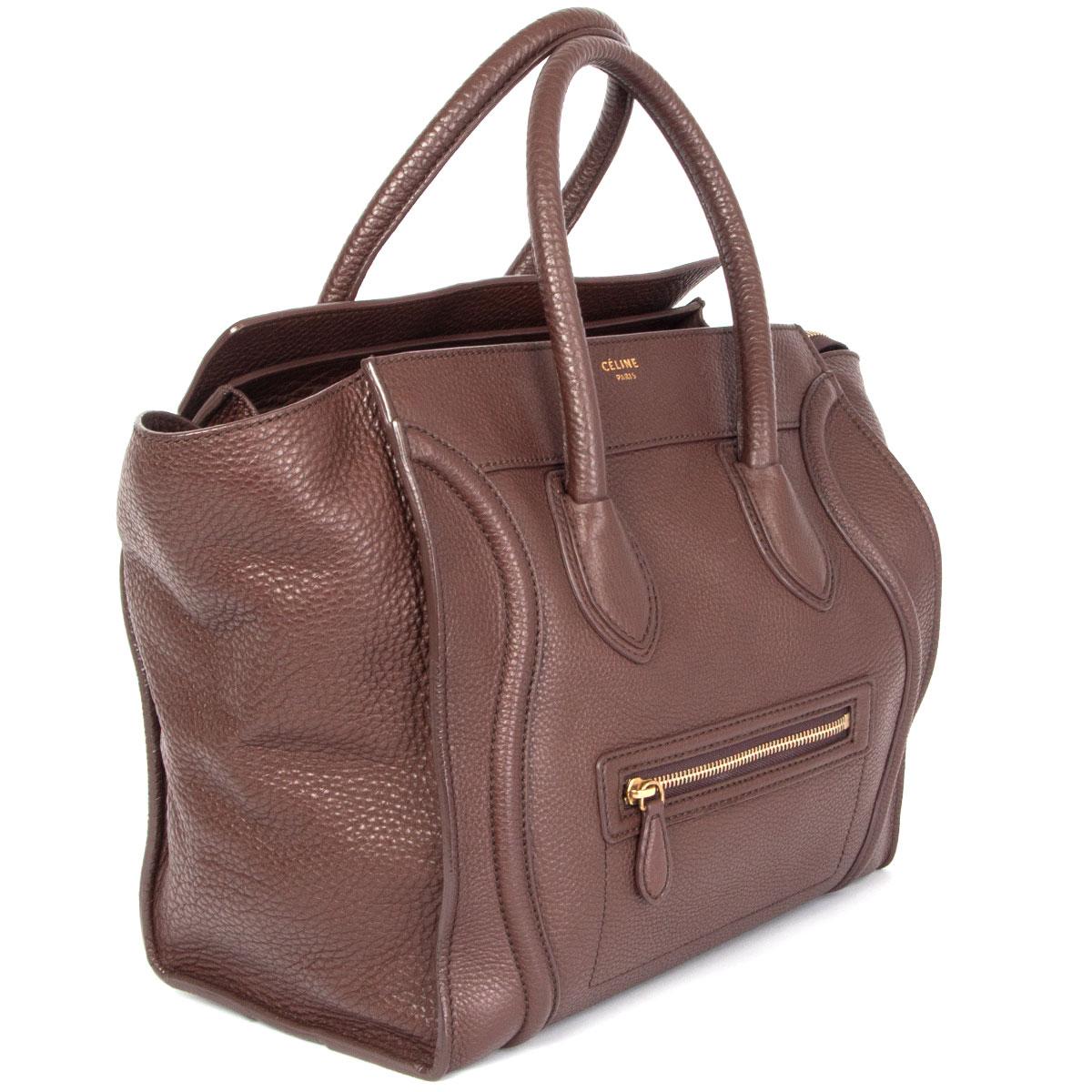 100% authentic Céline Mini Luggage tote bag in chocolate brown grained calfskin. Lined in dark brown microfibre with one zipper pocket against the back and two open pockets against the front. Has been carried and is in excellent condition.