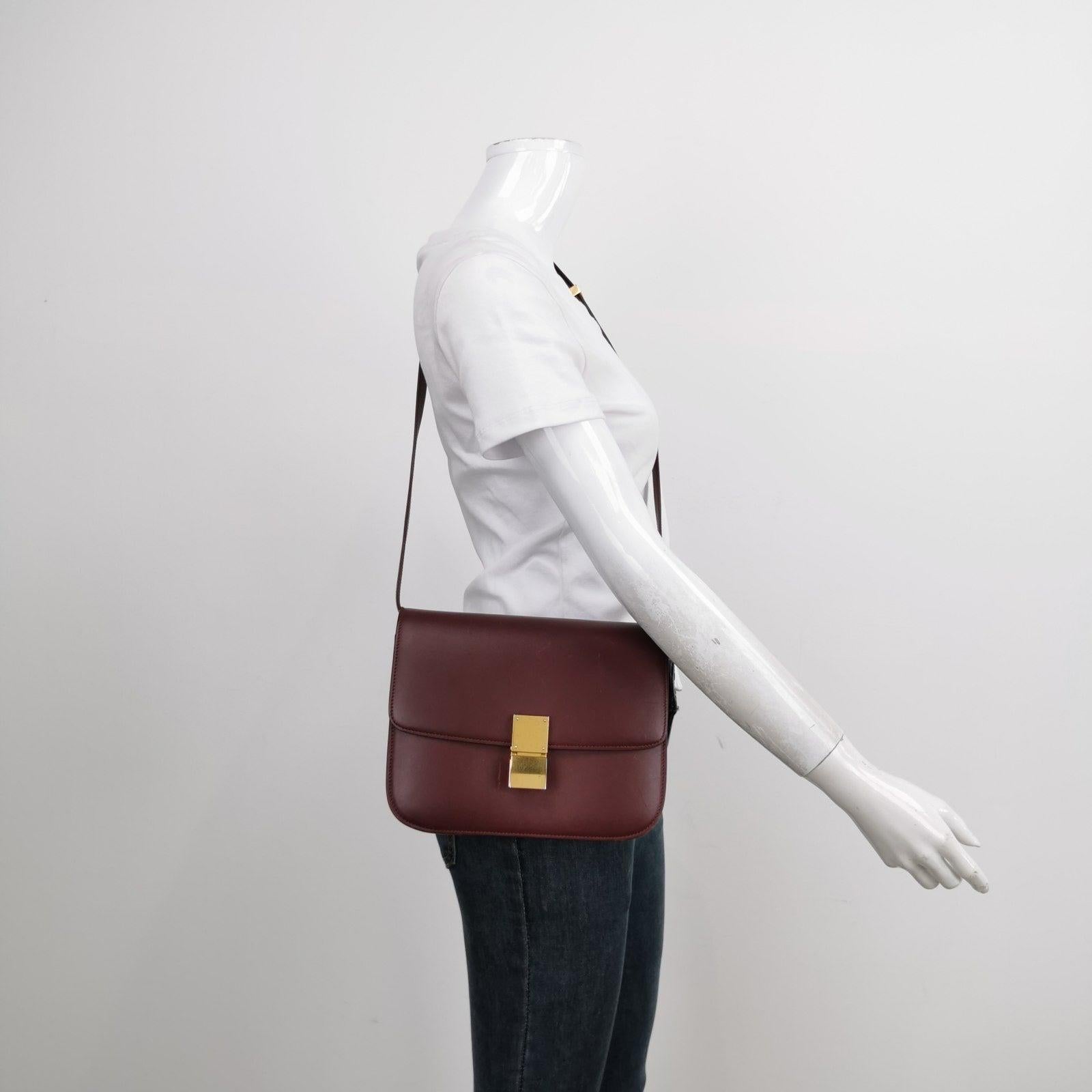 CELINE Classic Flap Burgundy Box Leather crossbody bag These are professional photos of the actual bag offered by Luxbags. This CELINE Classic Flap Grey Box Leather crossbody bag has a perpetually stylish design and roomy and easy-to-organise