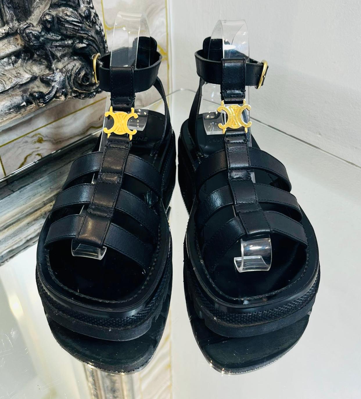 Celine Clea Triomphe Gladiator Leather Sandals

Black sandals detailed with gold ‘Celine‘ embroidered  Triomphe logo to the vamp. 

Featuring triple straps to the front and adjustable buckle ankle closure. 

Designed with chunky lug rubber outsoles