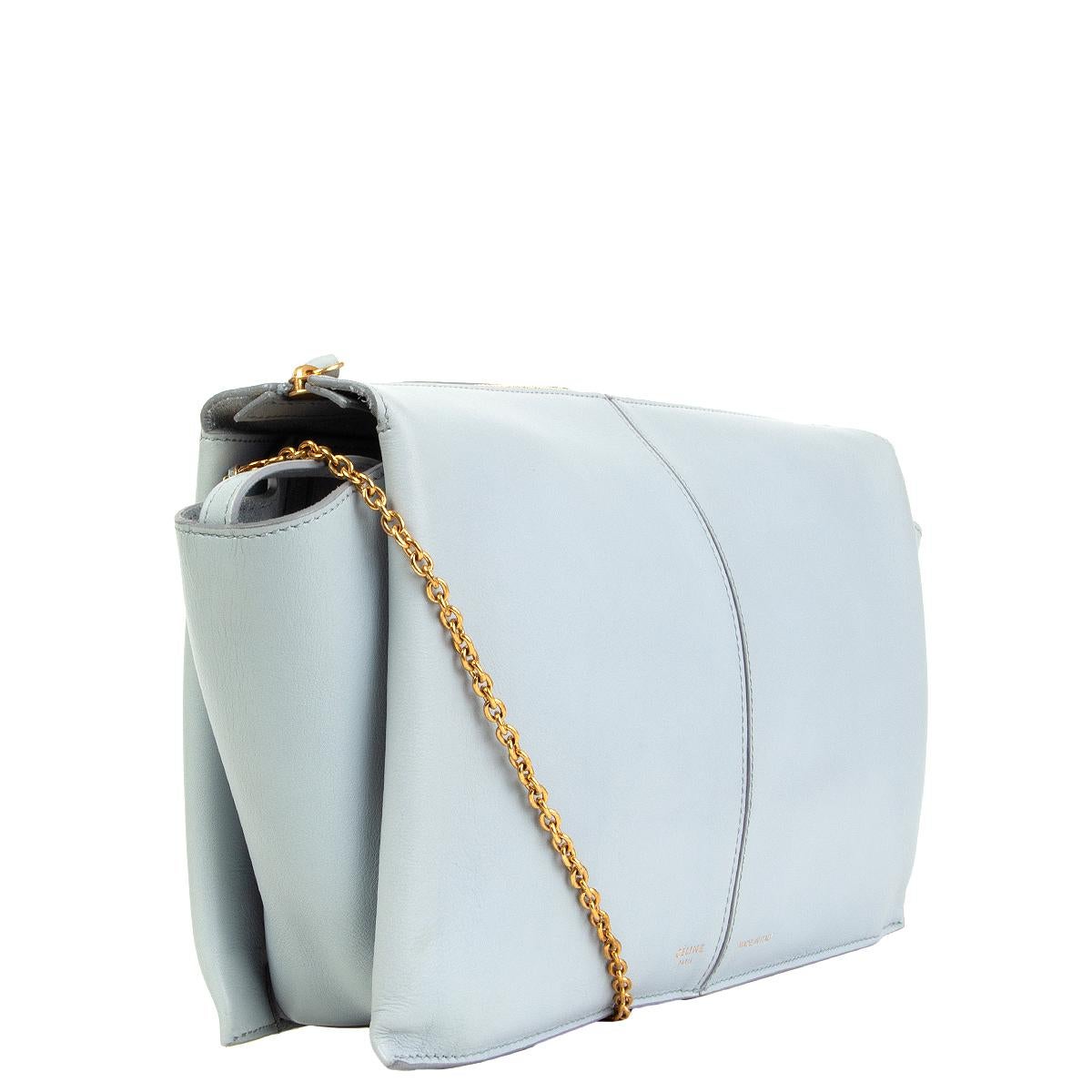 Celine 'Tri-Fold Clutch on Chain in Cloud (dusty light blue) Supple Nautral Calfskin leather. Closes with a zipper on top. Inside is divided into three compartement  . Unlined with a zipper pocket in the middle pocket. Has been carried and is in
