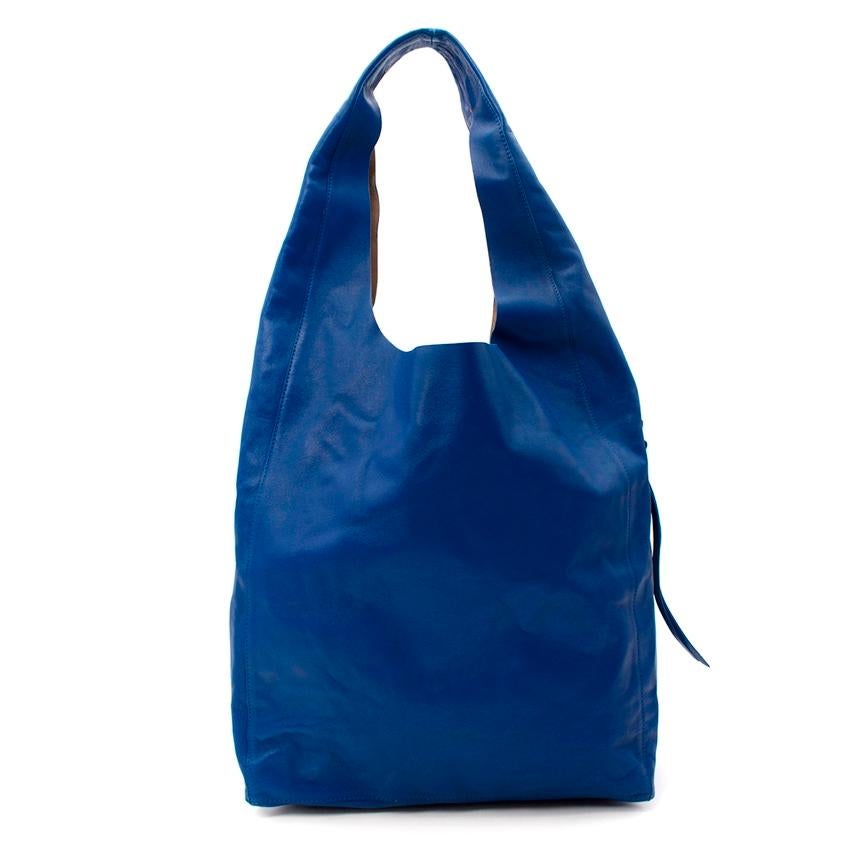Celine Cobalt Blue Leather Sling Shoulder Bag
 

 - Minimalist classic from Phoebe Philo era Celine
 - Soft, supple leather in vibrant blue hue
 - Sling shape, casually looping over the shoulder, with a capacious tote base
 - Gold-tone zipper detail