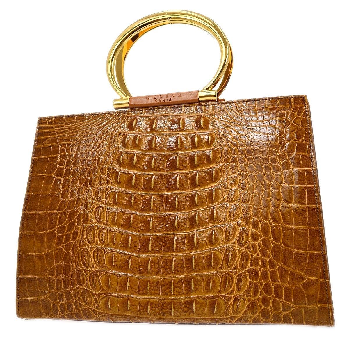 Pre-Owned Vintage Condition
Crocodile 
Gold Tone Hardware
Woven Lining
Measures 12.5