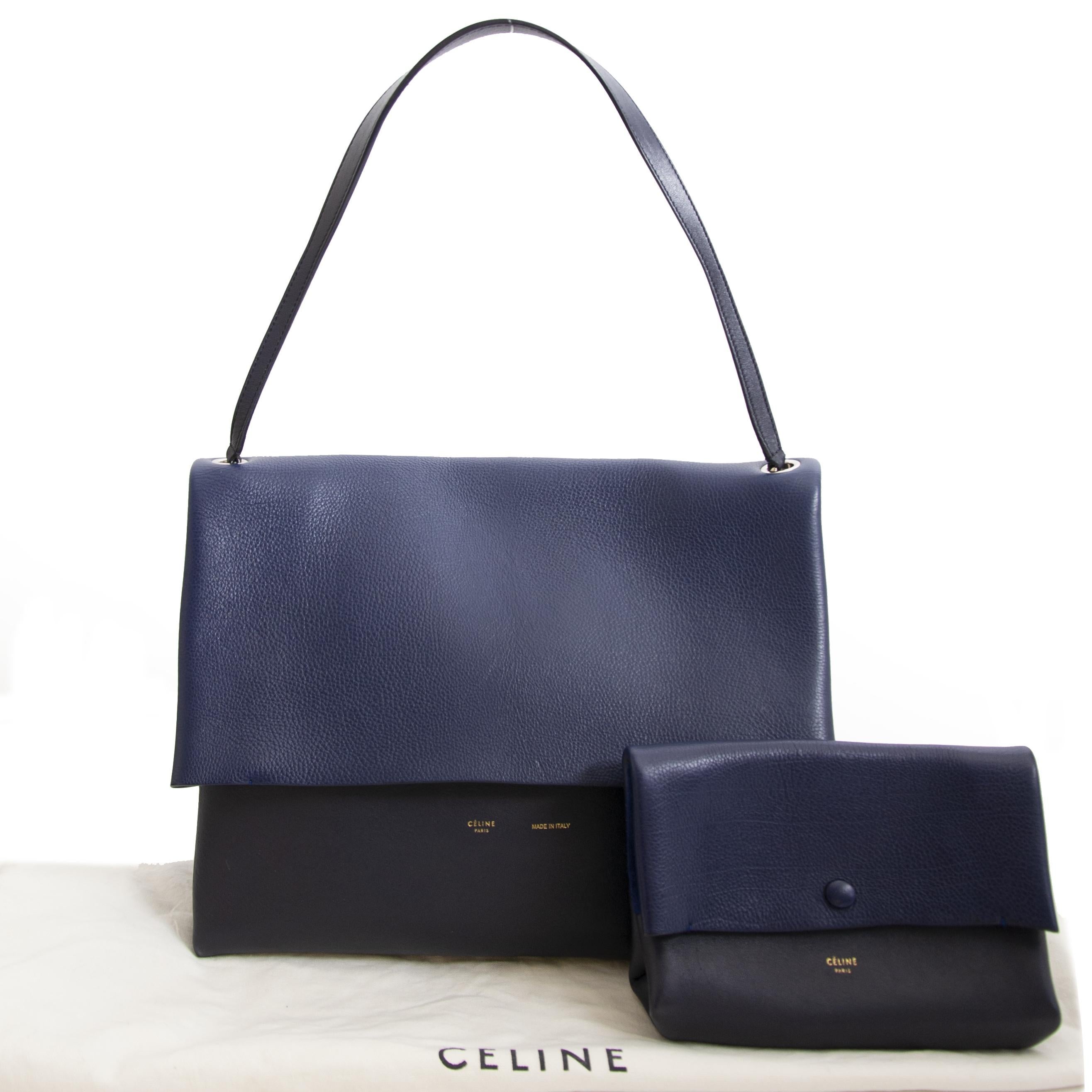 Good condition



Celine Colorblocked Leather Shoulder Bag



Feeling blue? No need to worry because this blue duotoned Celine bag will fill you with joy. It's the perfect bag for a day out because it will fit all our essentials. Combine with a