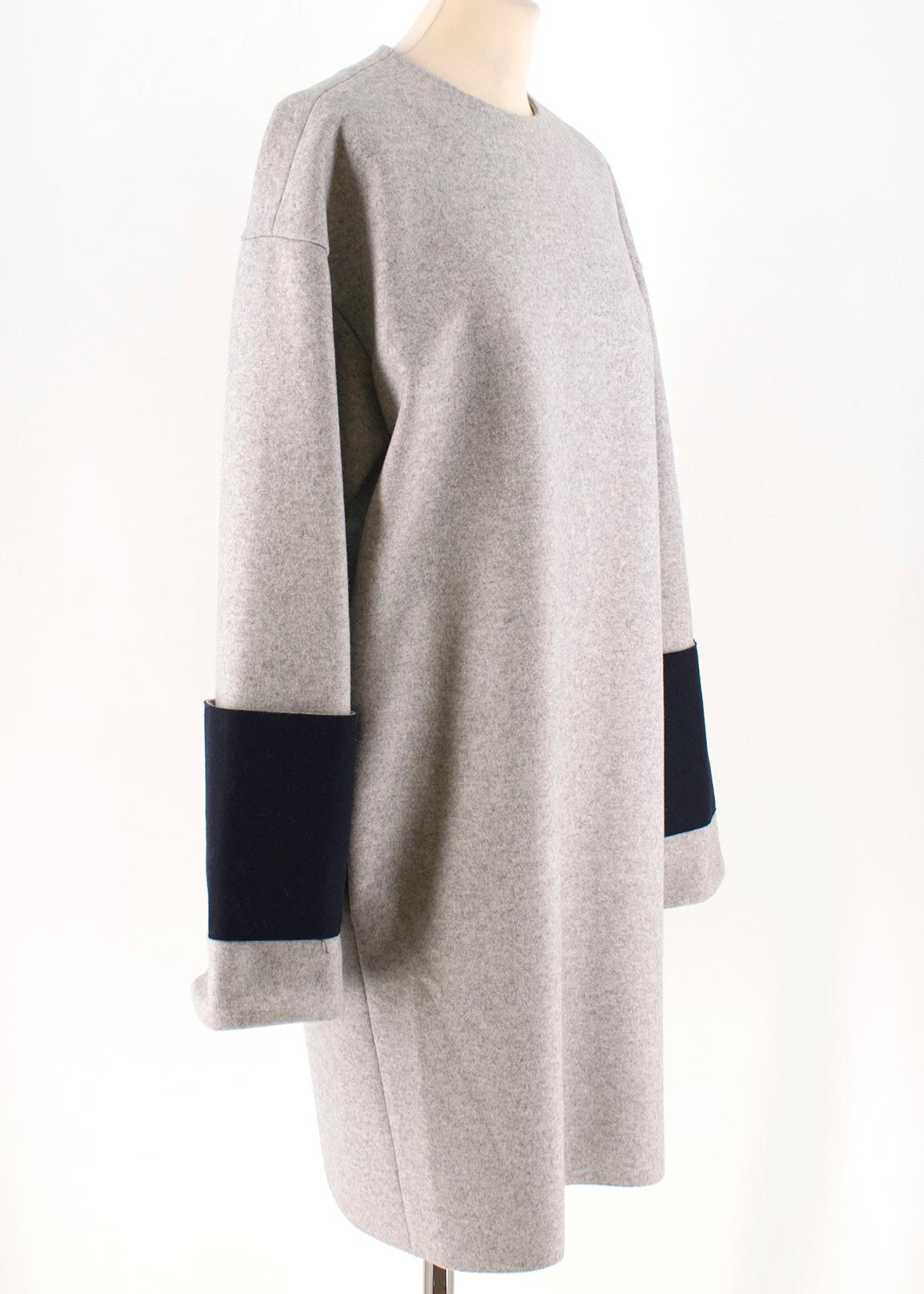 Celine contrast-cuff wool shift dress

- Light-grey, heavyweight bonded wool
- Round neck, long sleeves 
- Contrasting navy boiled-wool oversized cuff panel 
- Centre-back concealed-zip fastening 
- Light-grey satin binding 

Please note, these