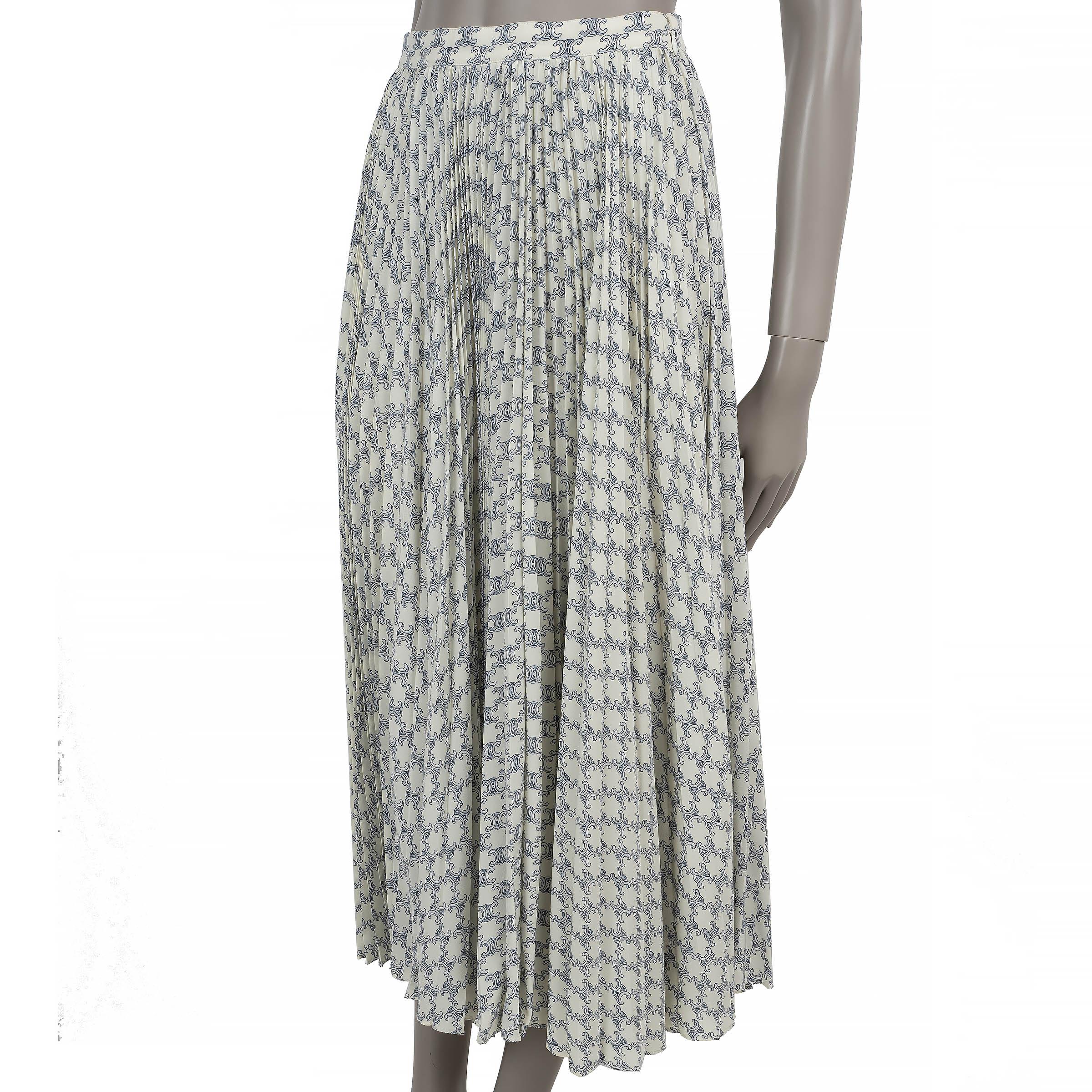 This 100% authentic Celine skirt is crafted in cream sun-pleated crepe silk (content tag missing) with a delicate light blue all-over Triomphe print. Designed with a high-waisted silhouette and midi length, it opens with a concealed side zipper and