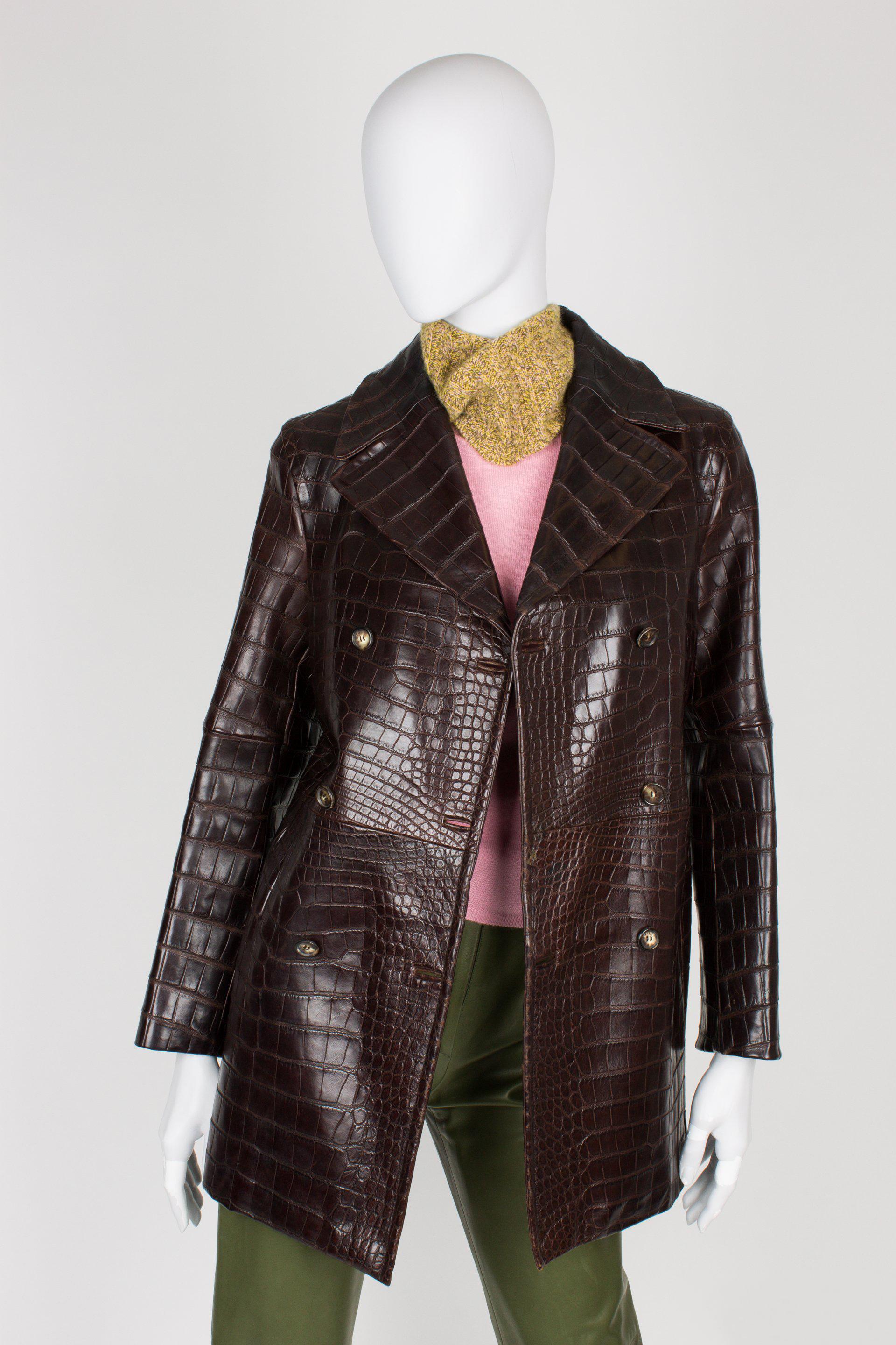 Double breasted coat by CELINE fully made of dark brown crocodile leather. Soooo beautiful!

Six button front closure, large lapels and two bound pockets on the hips. Fully lined with shiny brown fabric.

These coats were custom made by special