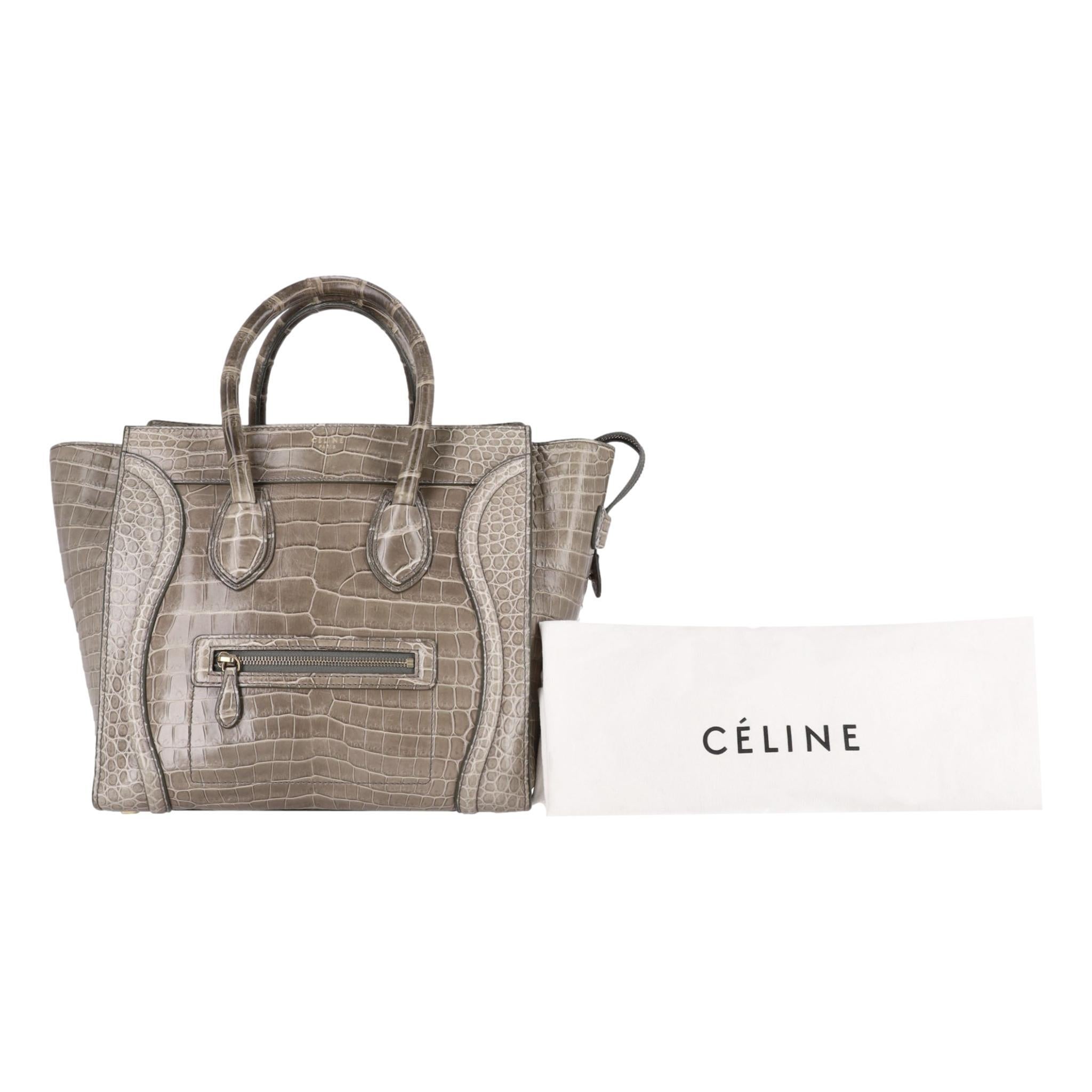 Celine Crocodile Skin Luggage Bag

Luxury tote bag in exotic skin.

Grey with a greenish undertone, shiny Crocodile skin with gold hardware.

Featuring sturdy top carry handles and detailed stitching. Leather interior.

Rpr £30,000

Size - Height