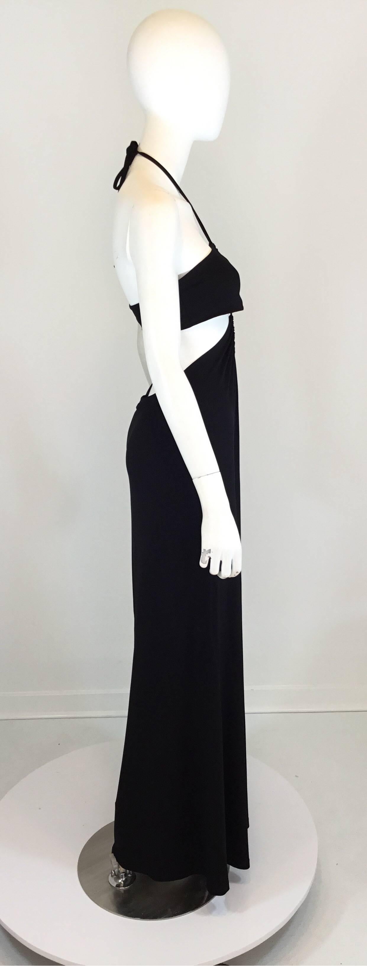 Celine cutout dress features a halter neck style and a cutout bodice detail. Made of 95% viscose and 5% elastane, size small, made in France. 

Garment has stretch:
bust 32'', waist 36'', length 50''