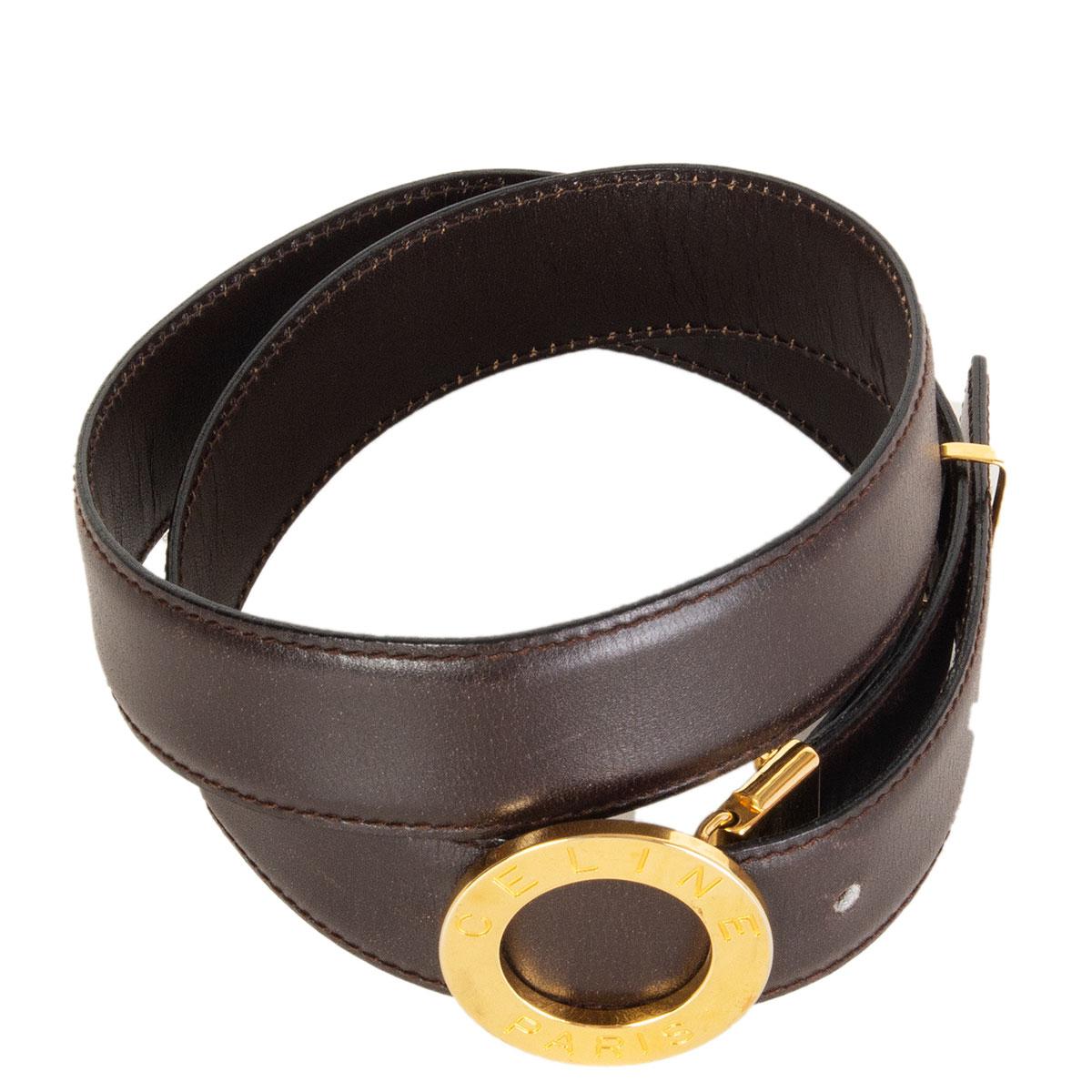 100% authentic Celine belt in espresso brown leather with round logo embossed gold-tone metal buckle. Has been worn with some scretches on the buckle. Overall in very good condition. 

Tag Size
70

Width 3cm (1.2in)
Fits 67cm (26.1in) to 77cm