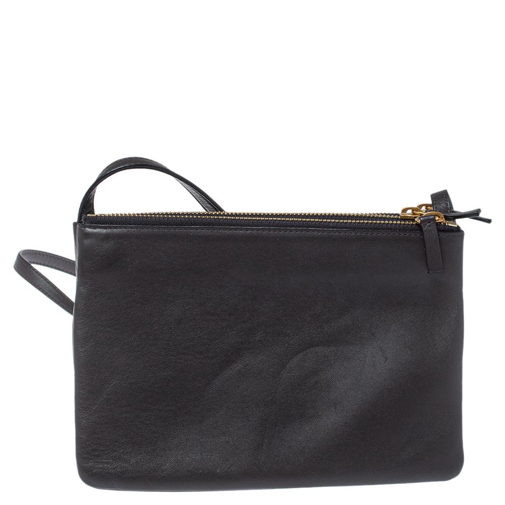 Designed to make an impression, this beautiful bag from Celine is a prized buy. Comfortable and easy to carry, this leather creation comes in a dark grey color with the brand logo embossed on the front. It has an adjustable shoulder strap and an