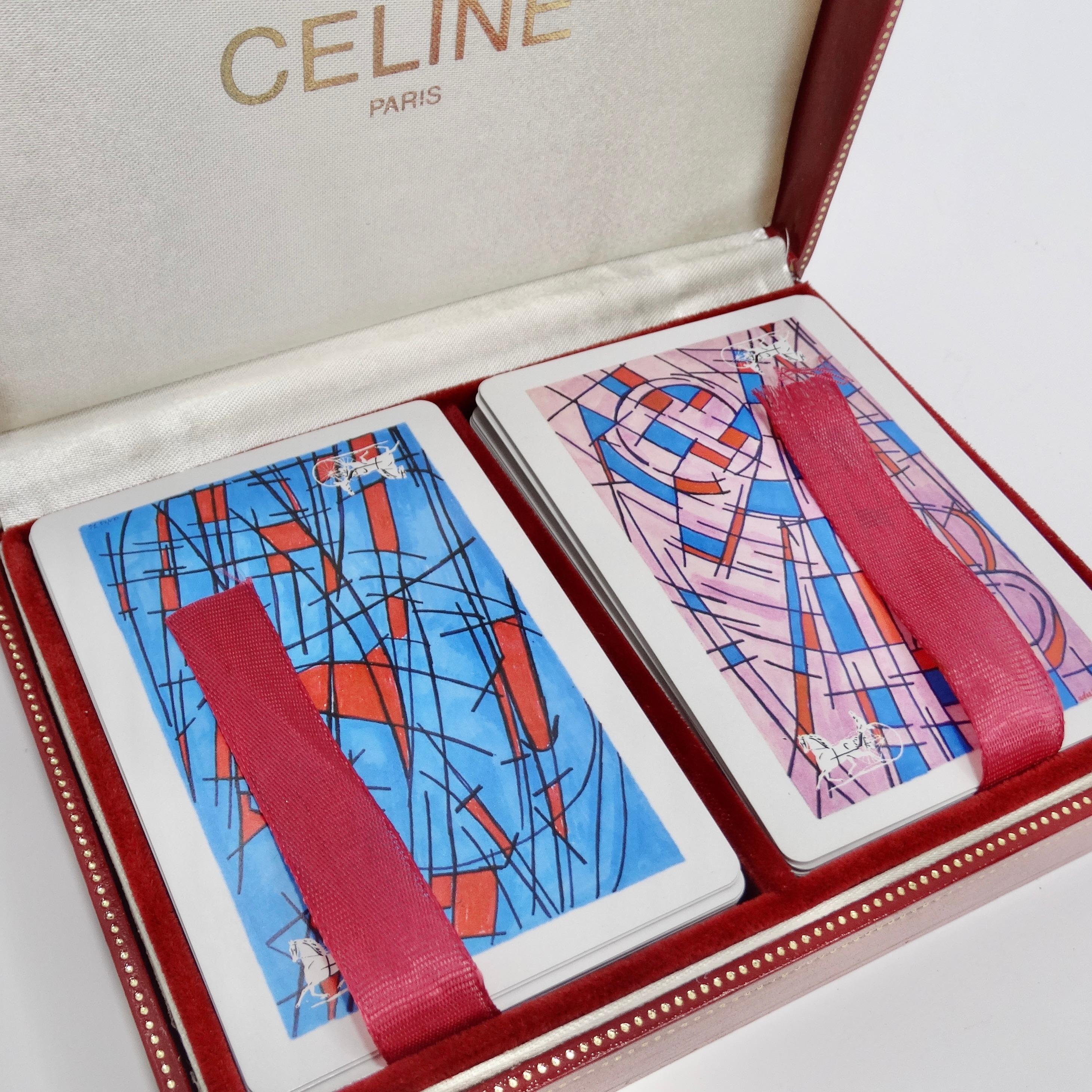 Introducing the exquisite Celine Playing Cards Deck, a classic set of two playing cards that will elevate your game nights to new heights of luxury and sophistication. Encased in their original box, these playing cards are not just a game but a