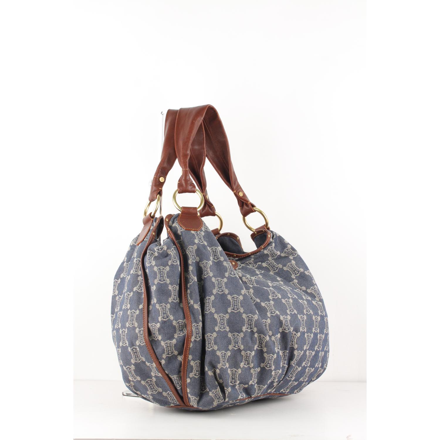 Celine Denim Blue Macadam Bittersweet Hobo Shoulder Bag

Material : Denim
Color : Blue
Model : Bitterweet
Gender : Women
Country of Manufacture : China (imported)
Size : Medium

Bag Depth : 5.5 inches - 14 cm 
Bag Height : 13 inches - 33 cm
Bag