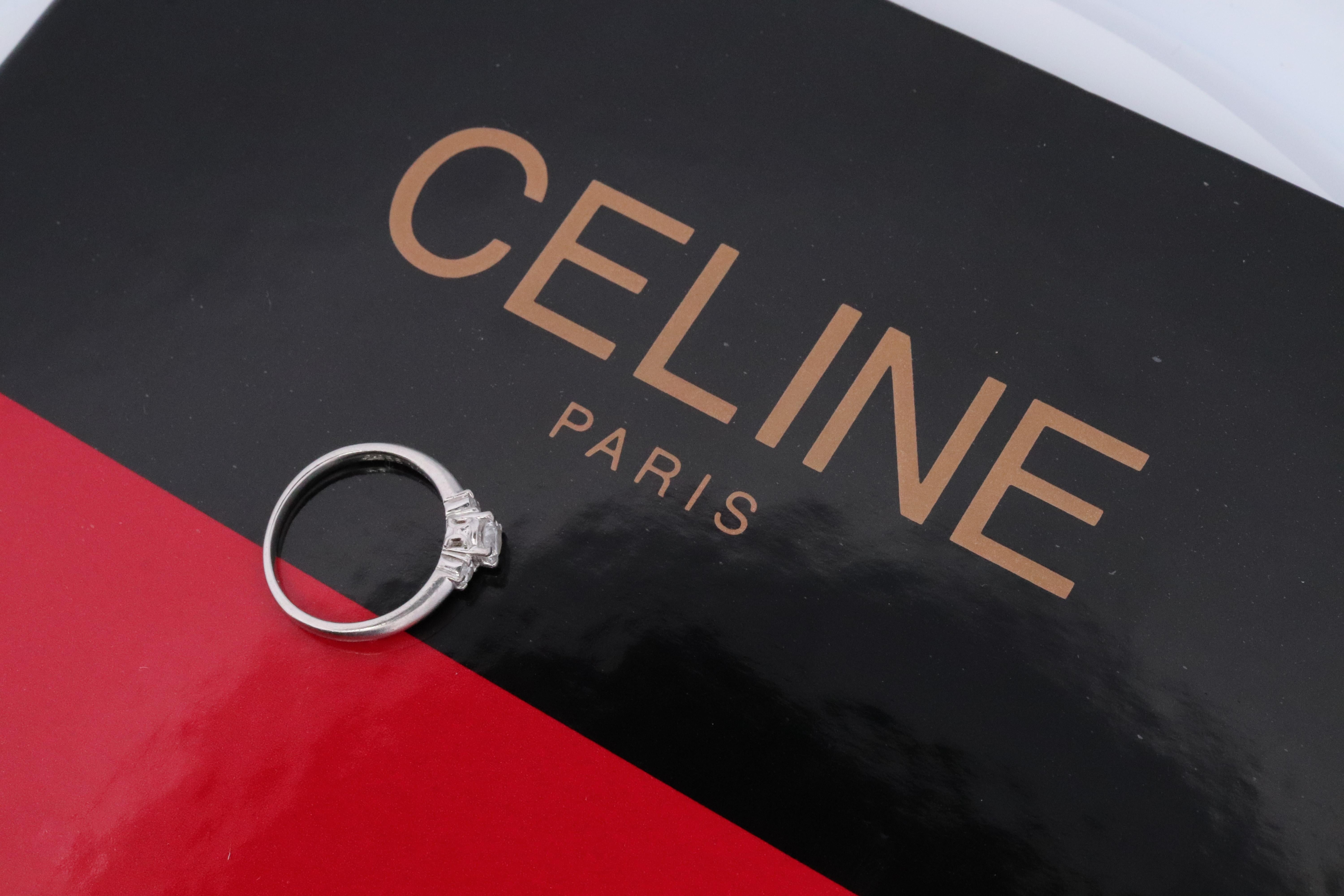Genuine Celine Diamond Ring.

Diamond Solitaire with accents Engagement ring.

Certified. Comes with Celine Certificate of Authenticity.

Details:
Size 5
Pt900 Platinum
0.26ct with F Color and VS1 Clarity