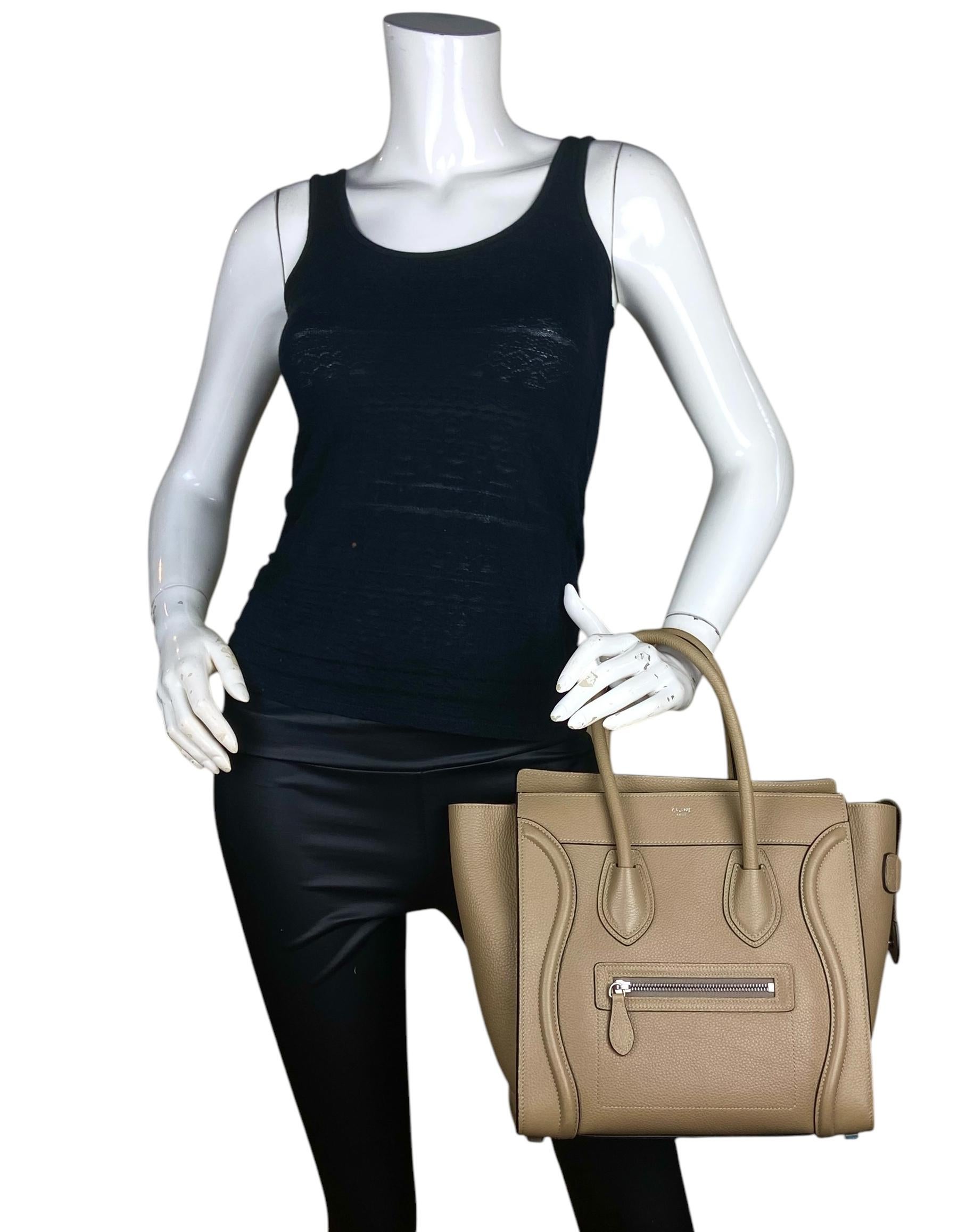 Celine Dune Drummed Calfskin Micro Luggage Tote Bag

Made In: Italy
Year of Production: 2022
Color: Dune
Hardware: Silvertone
Materials: Drummed leather
Lining: Suede
Closure/Opening: Zip top
Exterior Pockets: One zip
Interior Pockets:  One