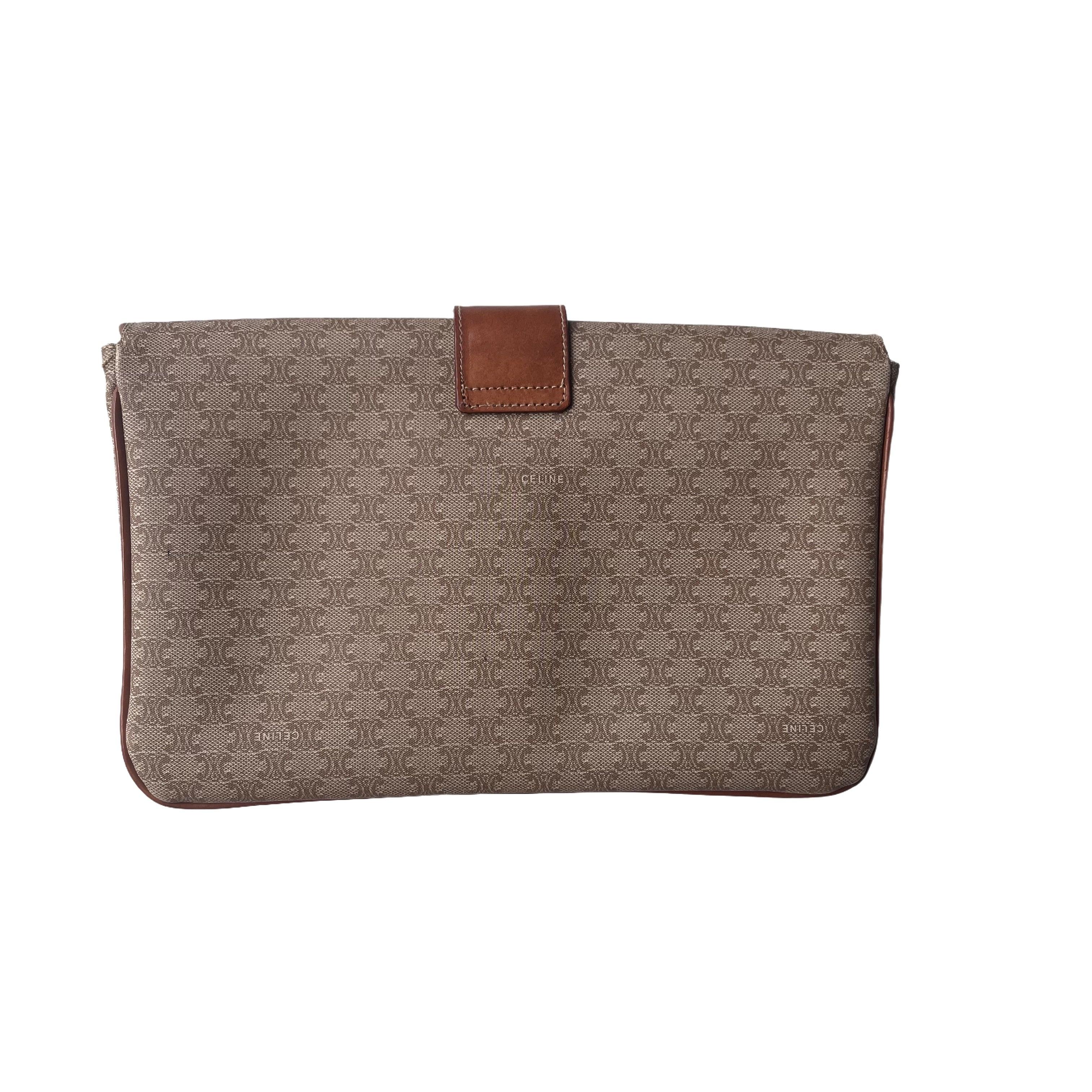 Celine Envelope Clutch bag in Brown Monogram These are professional photos of the actual bag offered by Luxbags. DETAILS Width 25 x Height 16.5 x Depth 3.5cm Brown monogram canvas with leather trim Magnetic clasp opening Leather lining Two metal