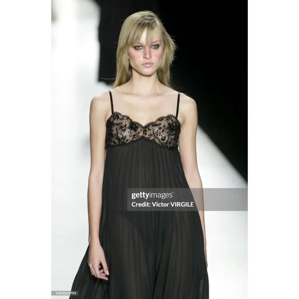 Divine Celine by Michael Kors black pleated gown from Fall Winter 2001 collection as seen on the runway that season, with delicate black lace and black beading on breast. 

Size on tag is 40, make sure to report to measurements for accurate fitting.