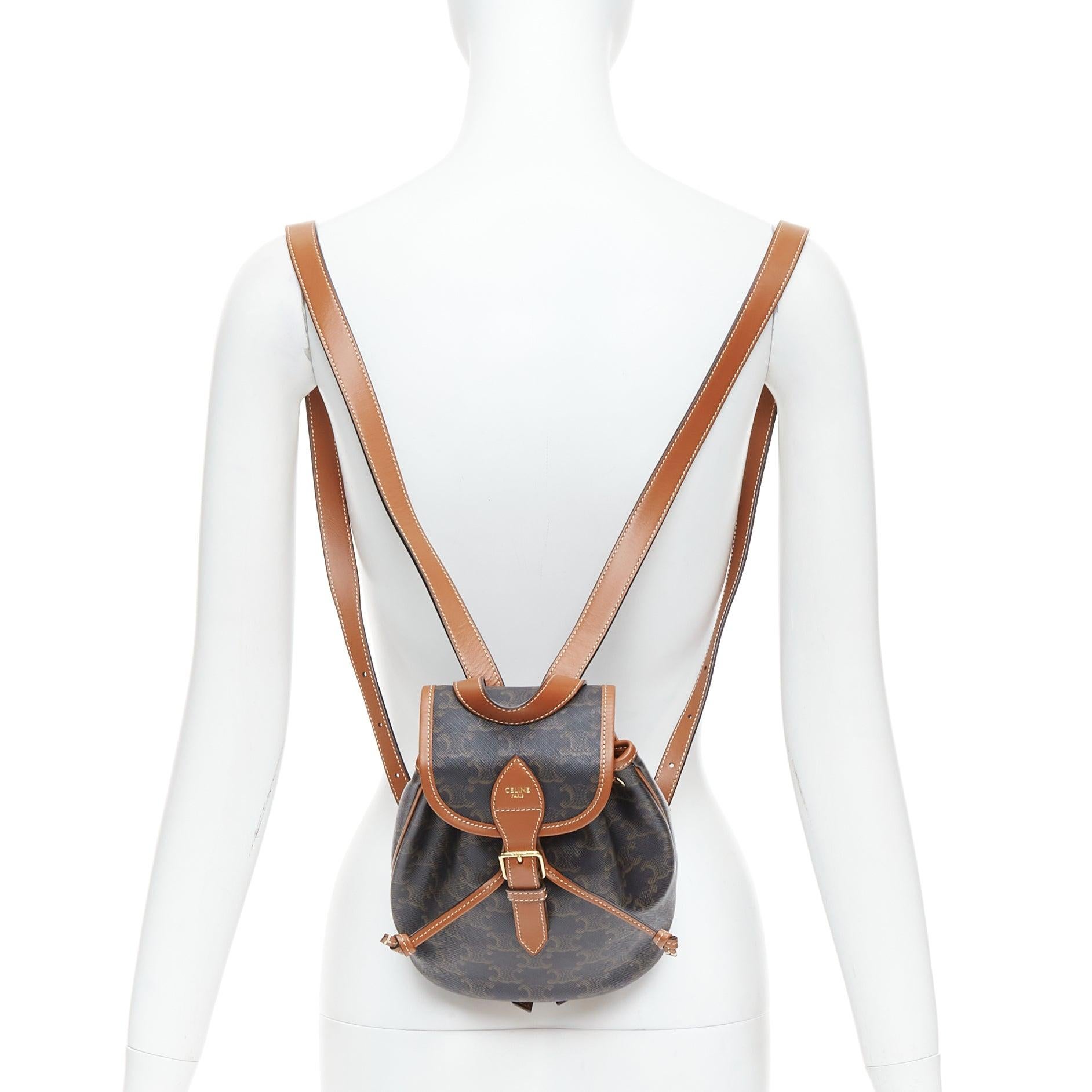 CELINE Folco brown triomphe monogram canvas mini backpack
Reference: KYCG/A00156
Brand: Celine
Designer: Hedi Slimane
Model: Folco Triomphe
Material: Canvas, Leather
Color: Brown, Tan Brown
Pattern: Monogram
Closure: Drawstring
Lining: Brown