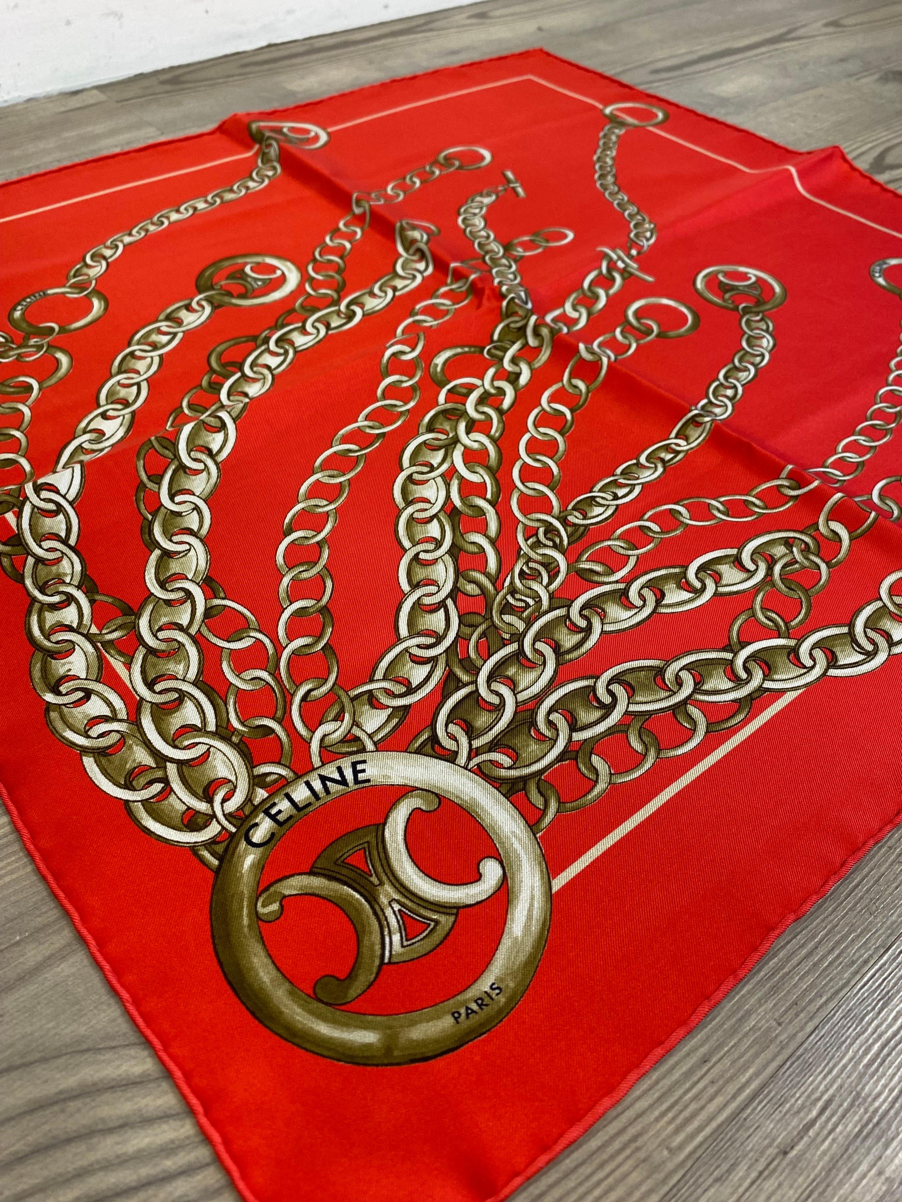 Red and gold Céline scarf. 
The label of the composition is missing but it is made of silk. 

Perfect condition.

53 cm x 55 cm 