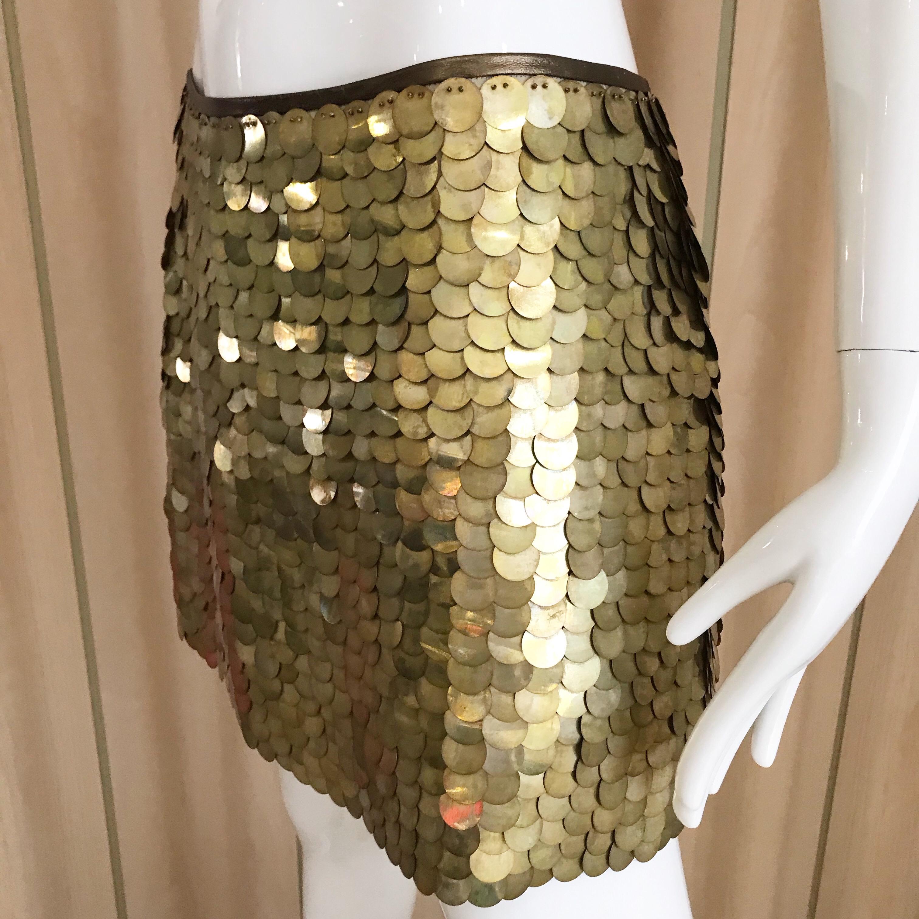Celine 2000s gold sequin Paillette mini Party skirt. 
Marked size: 40F
Measurement: Waist: 30 inches/ Hip: 38 inches/ Skirt length: 14 inches. 
Skirt lined in silk. 