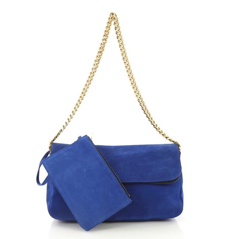 This Celine Gourmette Shoulder Bag Suede Small, crafted from blue suede, features chain strap and gold-tone hardware. Its flap opens to a black leather interior slip pockets. 

Estimated Retail Price: $2,300
Condition: Very good. Loss of shape,