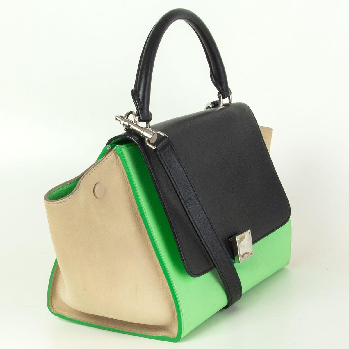  Céline 'Small Trapeze' Tri-Color shoulder bag in black, lime and sand  smooth calfskin. The bag features a looping top handle, an optional shoulder strap with silver clasps, expandable sides, and a cross over flap. Opens with a silver-tone press