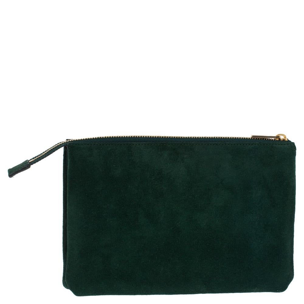 Crafted from suede, this clutch by Celine comes in a lovely shade of green. It flaunts a simple silhouette and exudes sophistication. It has a top-zip closure that leads to three compartments with ample space. The exterior features the brand