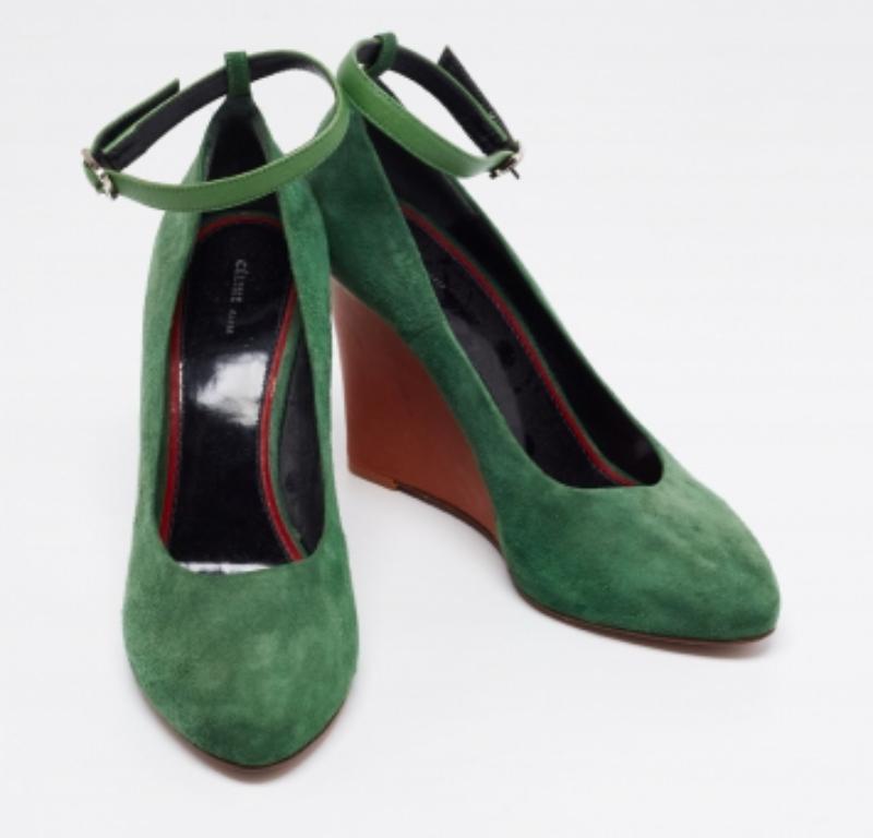 This pair of Celine pumps is the perfect inspiration for a stylish look. Constructed from suede, it is defined by wedge heels, ankle buckle closure, and silver-tone hardware.