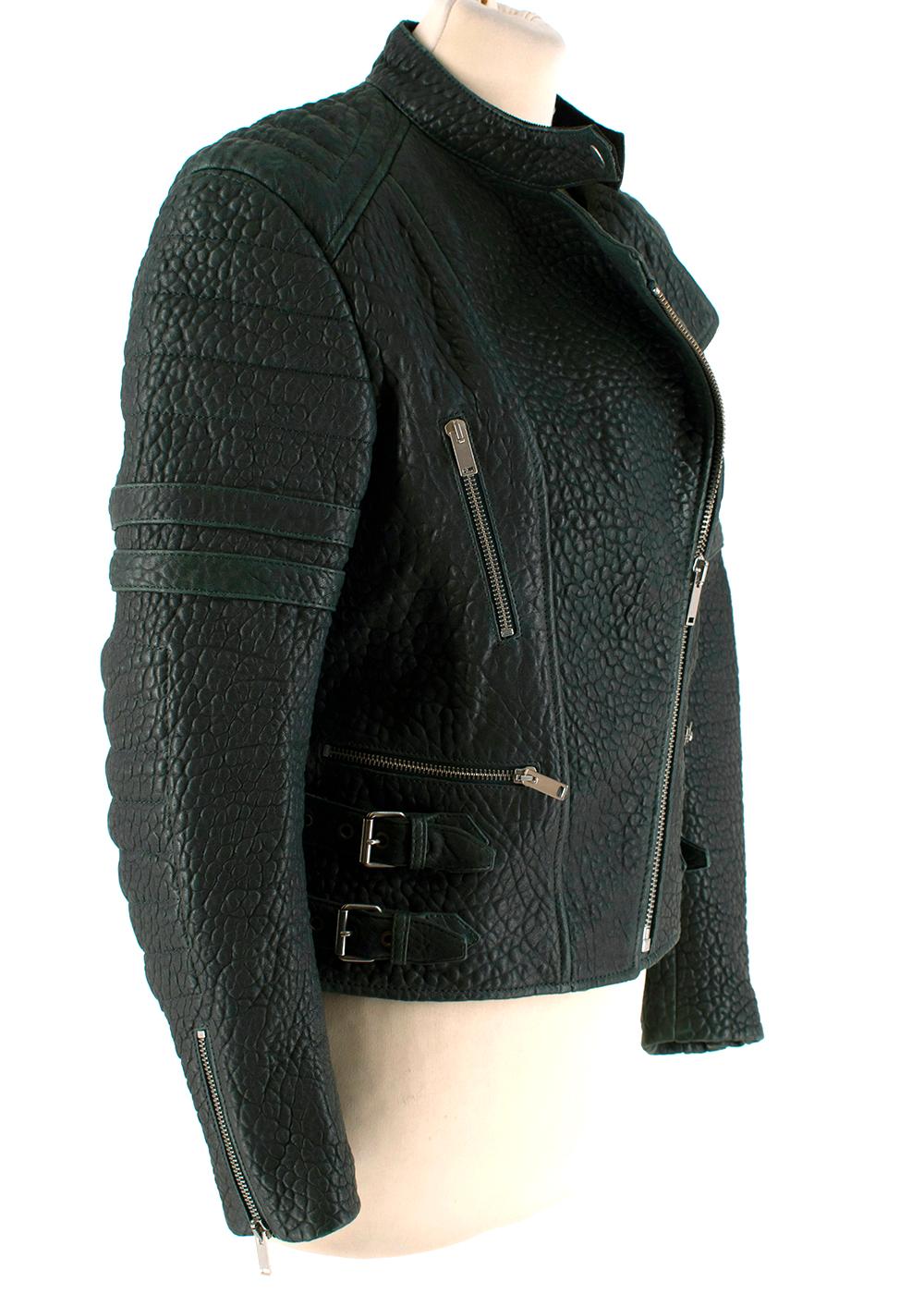 Celine Green Textured Lambskin Biker Jacket

- Celine by Phoebe Philo 
- Made of soft textured lambskin 
- Gorgeous green hue
- Classic biker elements 
- Quilted panels to the sleeves 
- Buckle fastening to the sides
- Slight distressed details  
-