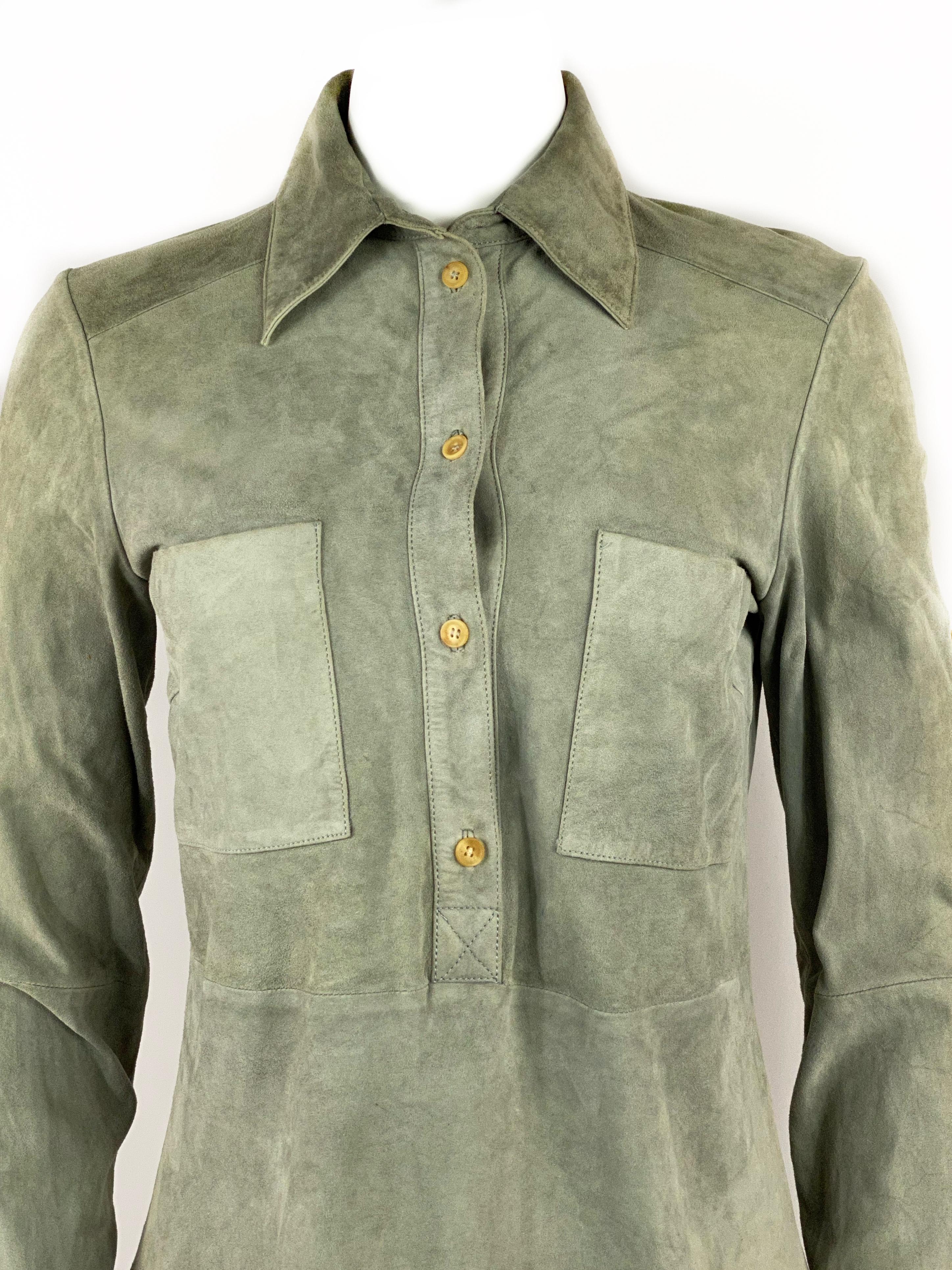 Celine Grey Green Olive Suede Button-Down Shirt Top Size 38

Product details:
Size FR 38
100% goat leather
Half front button closure
Collar detail
Featuring one pocket on each side 
Adjustable sleeves, long or half sleeve
Made in France

