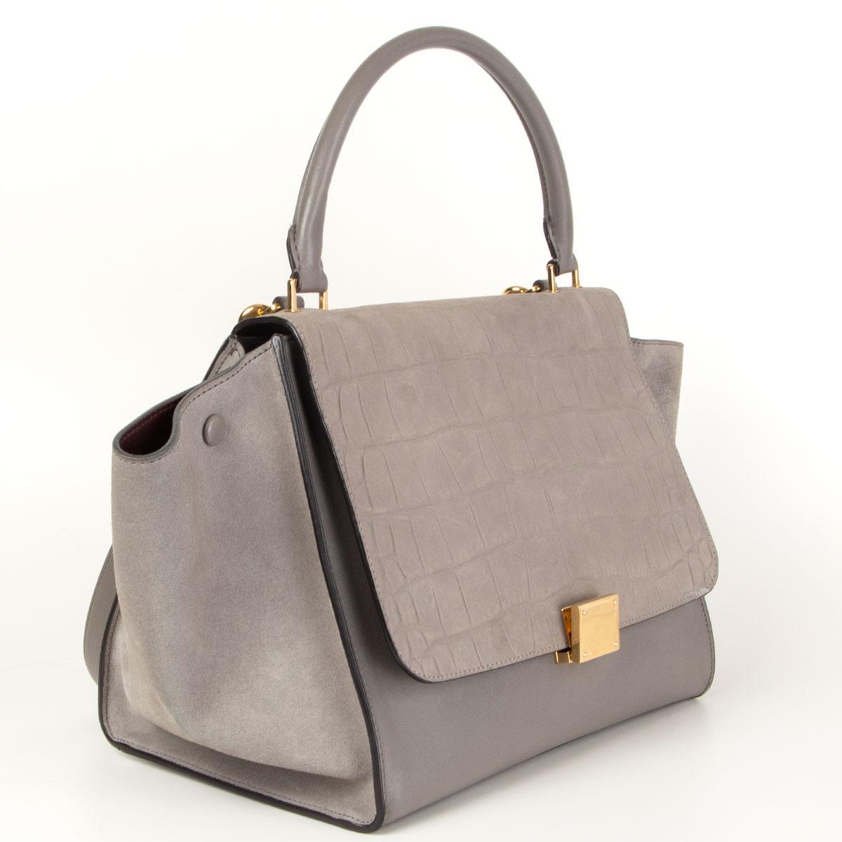 Céline 'Trapeze Medium' shoulder bag in grey calfskin, suede and an crocodile embossed flap. Opens with a zipper on top and is lined in burgundy calfskin with two open pockets against the back. Comes with a detachable shoulder strap. Has been