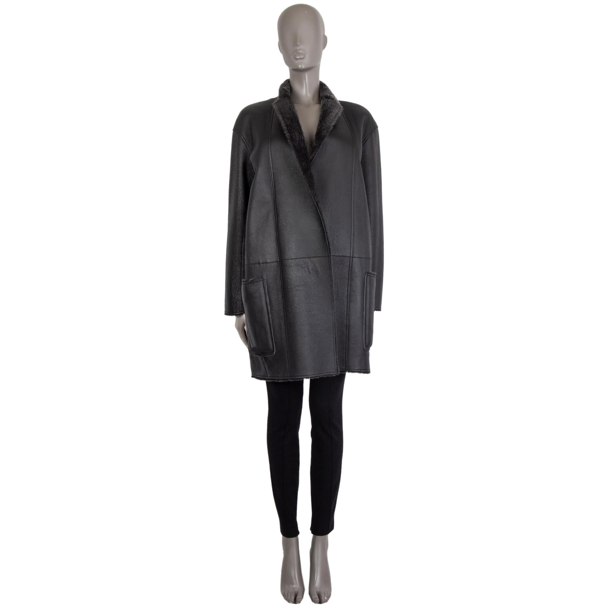 authentic Celine open reversible coat in charcoal lamb shearling and leather. With notch collar and two patch pockets on the sides accesible from the inside as well. Has been worn and is in excellent condition. 

Measurements
Tag