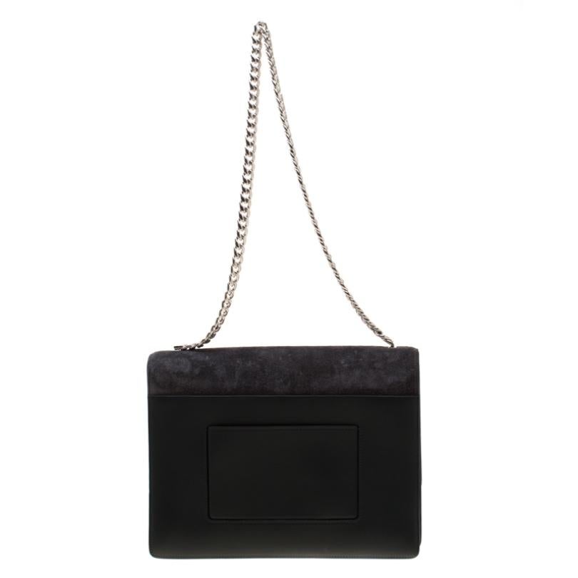 Get your hands on this stylish as well as handy shoulder bag from Celine. It is made from grey suede and styled with a flap that has the brand's logo in silver-tone. The bag is complete with a chain and a leather interior.

Includes: Original
