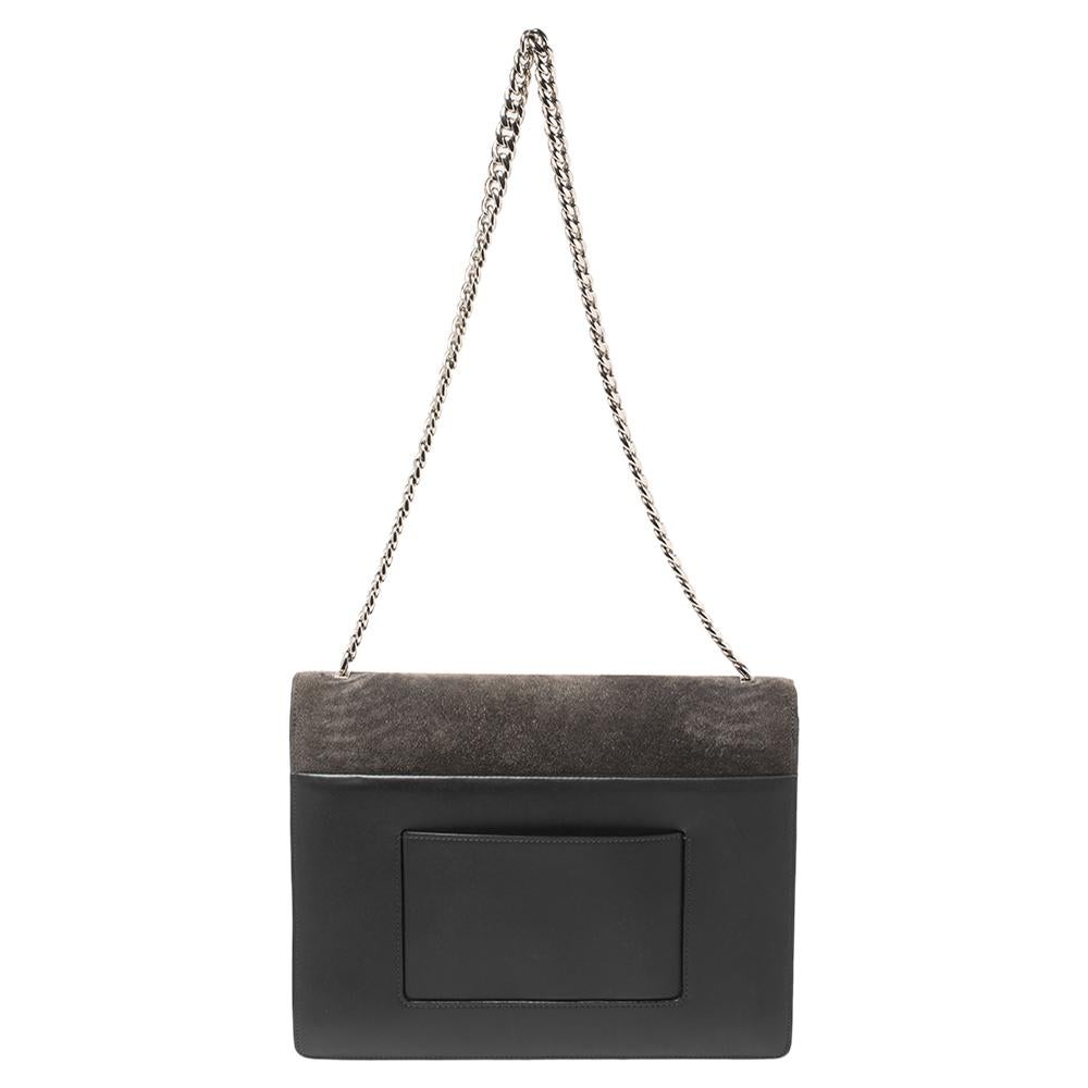 Get your hands on this stylish as well as handy shoulder bag from Celine. It is made from grey suede and leather and styled with a flap that has the brand's logo in silver-tone metal. The bag is complete with a chain and a leather