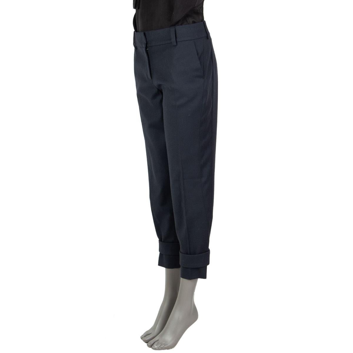 authentic Celine tapered pants in steel gray wool (94%), nylon (4%), elastane (2%) with velcro fastening details at the bottom. Opens with a hook and a zipper on the front and has slit pockets. Unlined. Has been worn and is in excellent