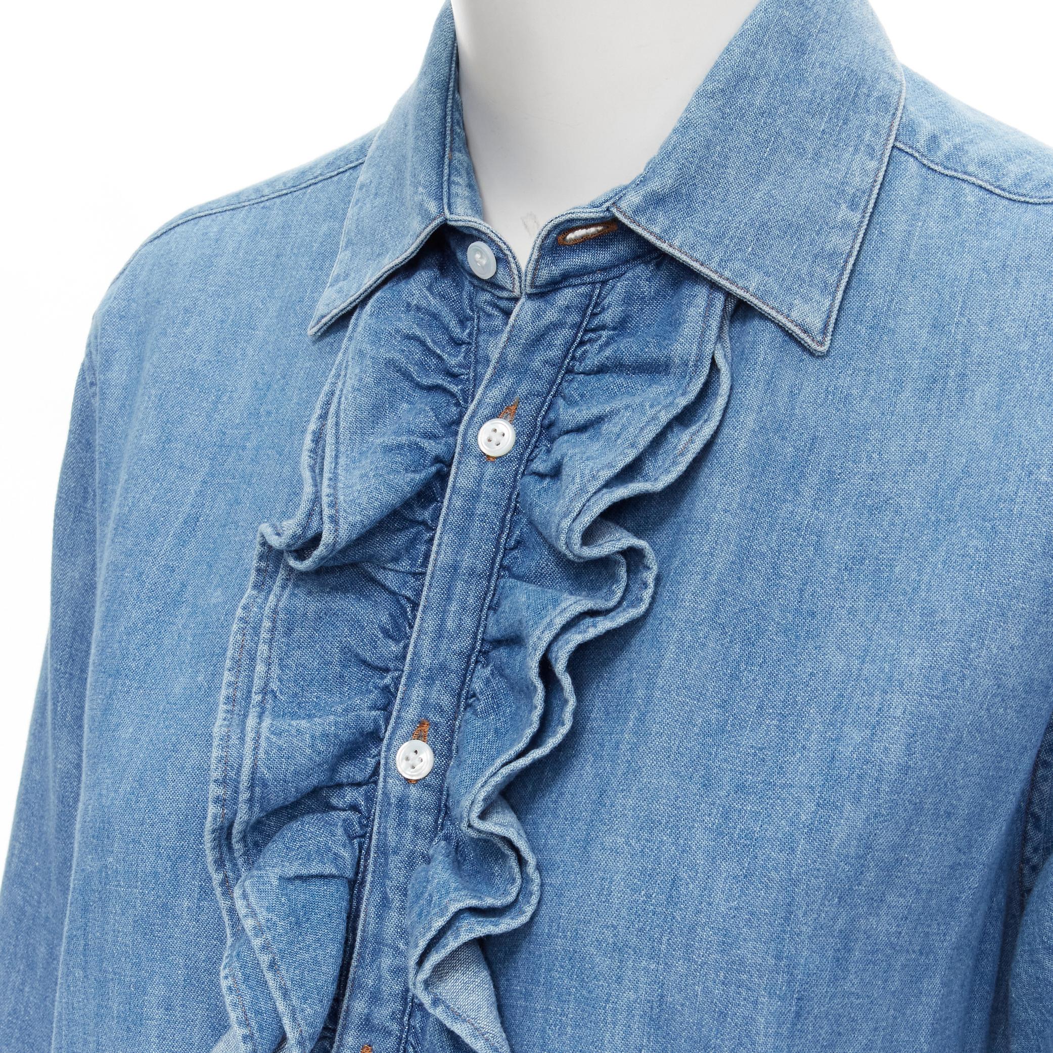 CELINE Hedi Slimane blue cotton denim frilled ruffle collar shirt 
Reference: MELK/A00130 
Brand: Celine 
Designer: Hedi Slimane 
Material: Cotton 
Color: Blue 
Pattern: Solid 
Closure: Button 
Extra Detail: Ocean Washed blue. Frilled ruffle collar.