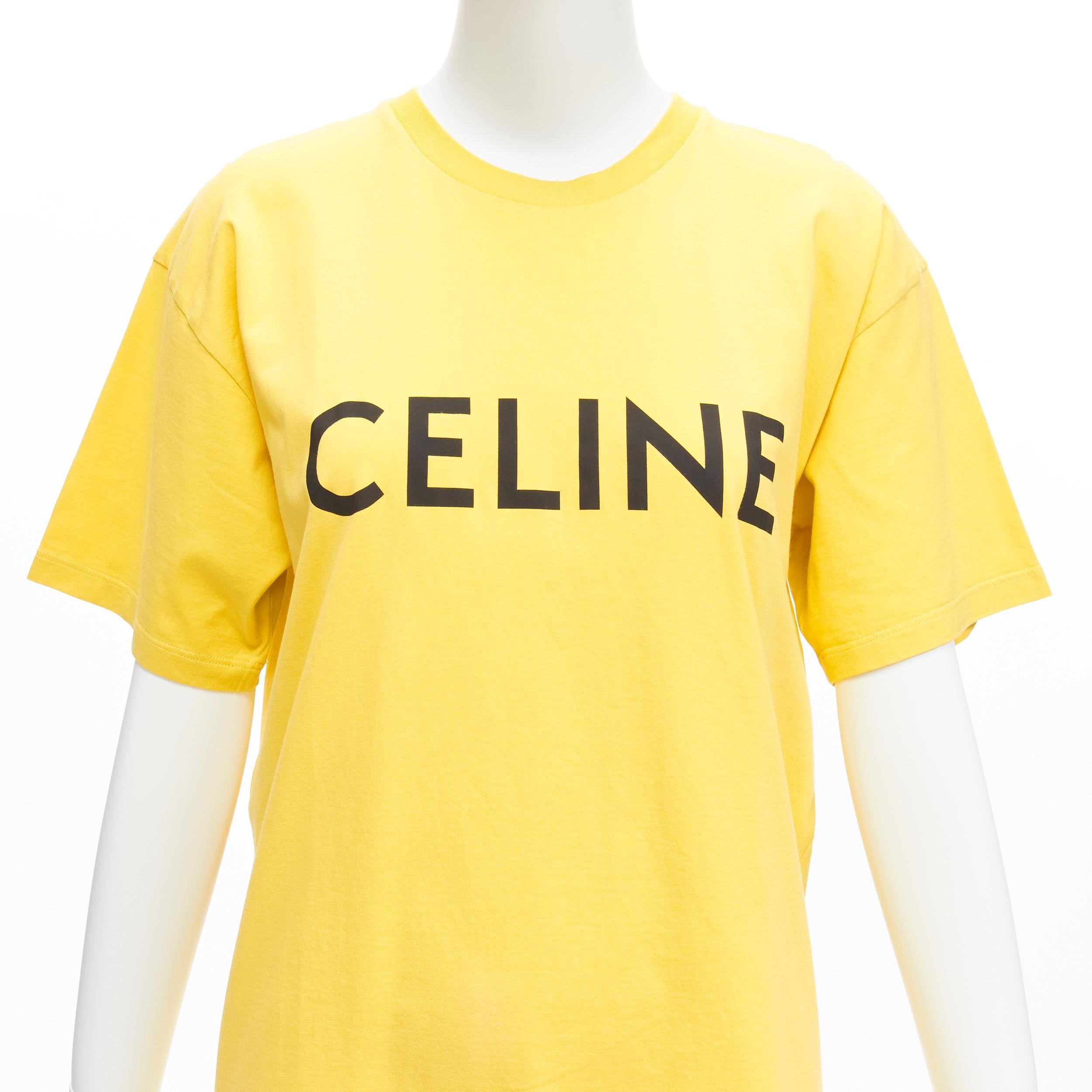 CELINE Hedi Slimane yellow black logo cotton short sleeves round neck tshirt XS
Reference: LNKO/A02123
Brand: Celine
Designer: Hedi Slimane
Material: Cotton
Color: Yellow, Black
Pattern: Solid
Closure: Pullover
Made in: Italy

CONDITION:
Condition: