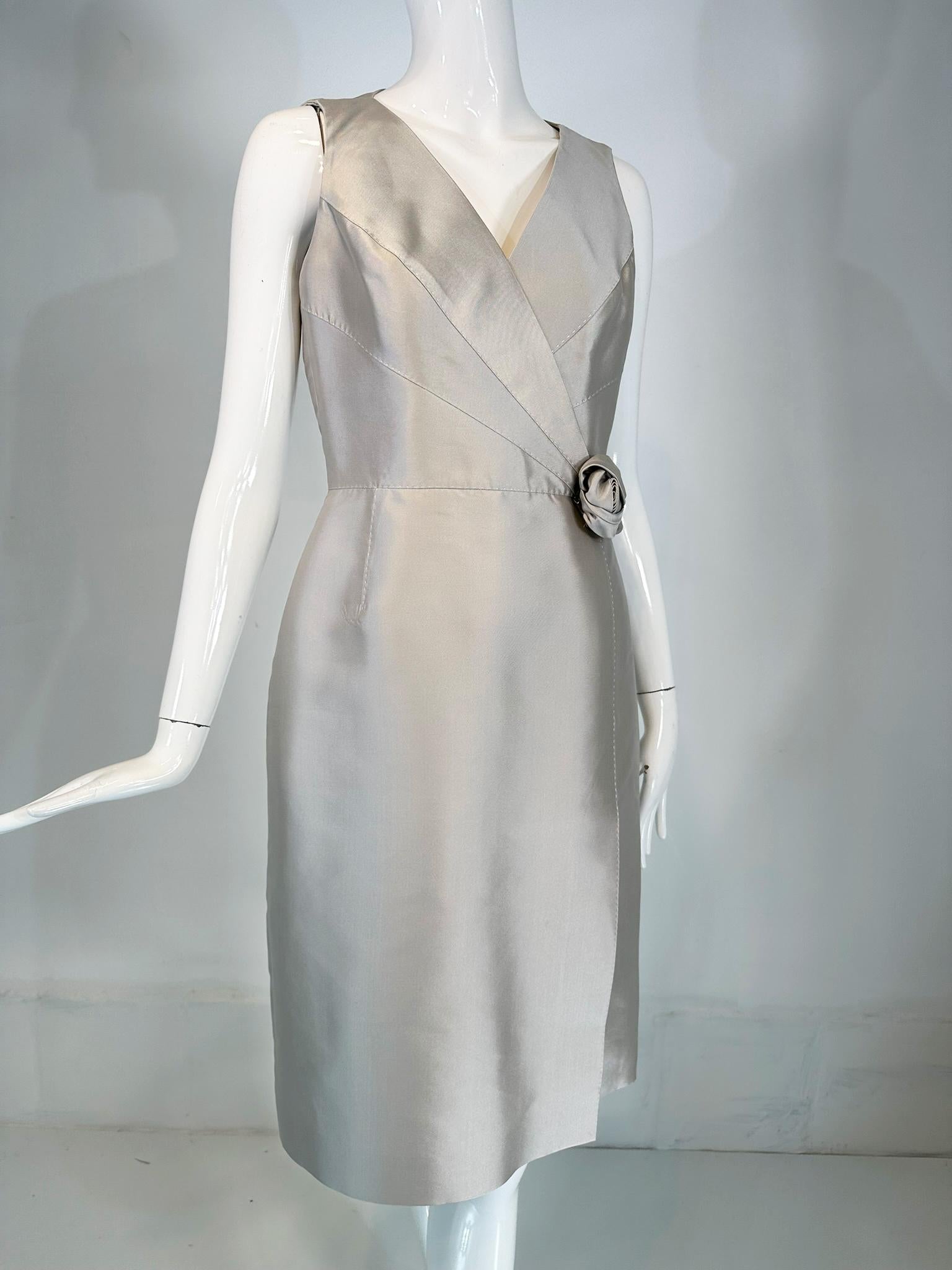 Celine ice blue silk cocktail dress marked size 42, V-neck suplice bodice dress with a srmed waist, the skirt has a 14 inch side front hem vent. The bodice and the skirt have detailed top stitching.. There is a single silk Rose Flower at the front