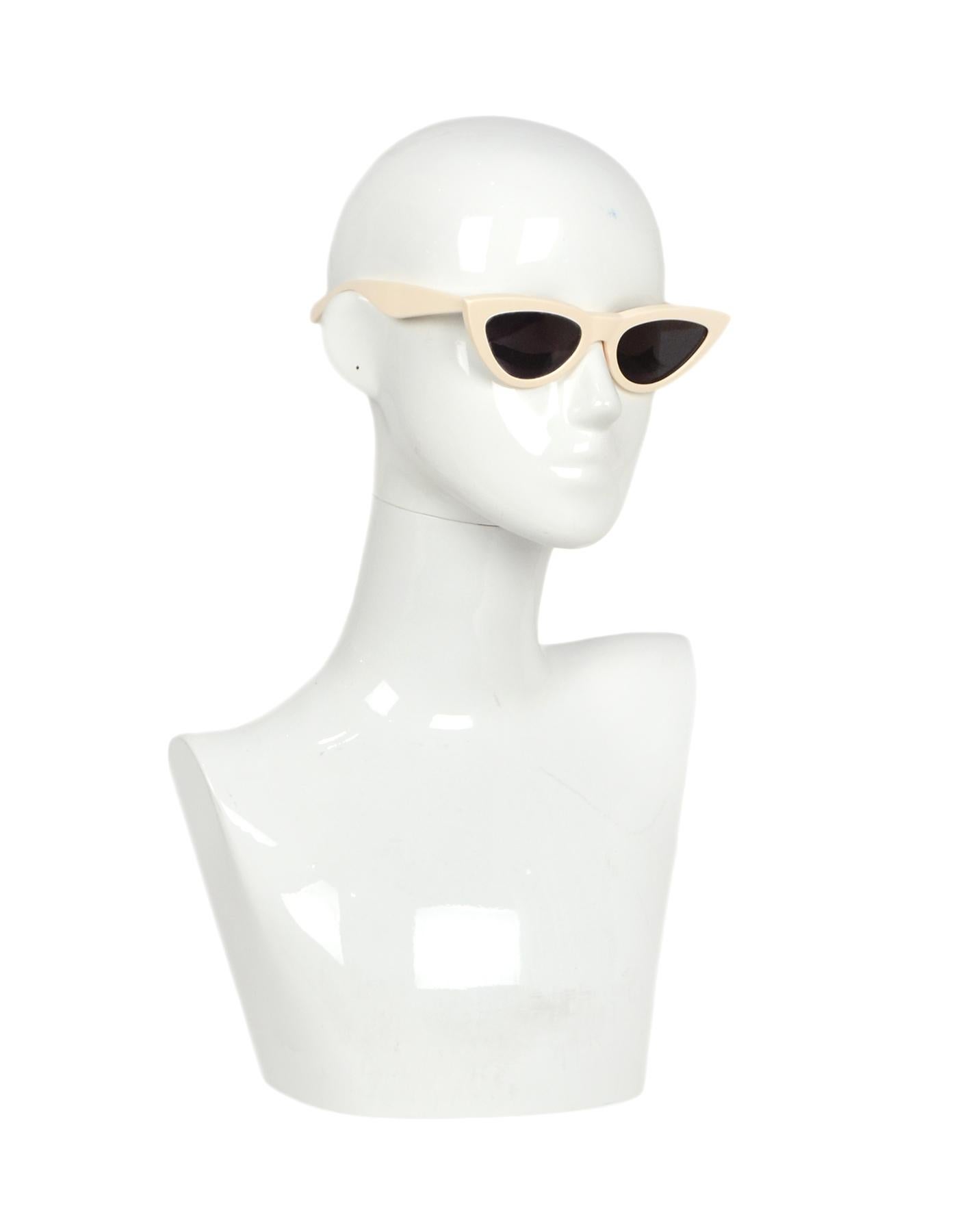 Celine Ivory Acetate Exaggerated Cat-Eye Sunglasses

Made In: Italy
Color: Ivory
Hardware: Silvertone hardware
Materials: Acetate
Overall Condition: Excellent pre-owned condition
Estimated Retail: $460 + tax
Includes: Case, box
Measurements: 
Length