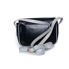Celine, Leather black tassel bag with white details