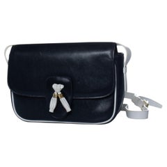 Celine, Leather black tassel bag with white details